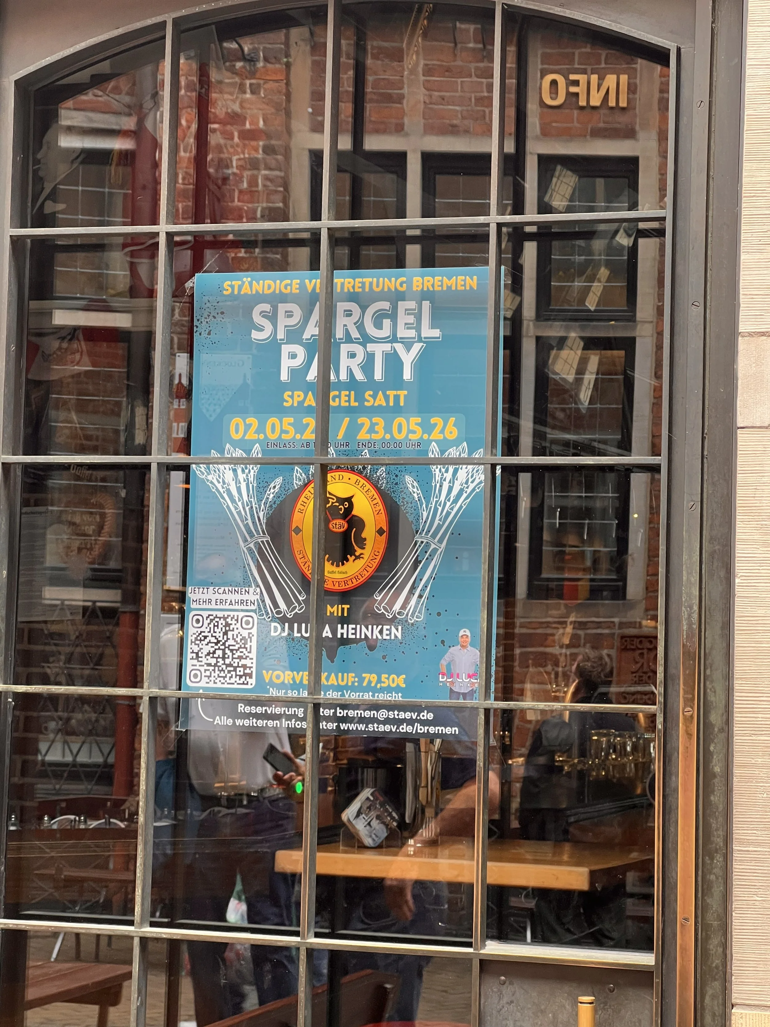 Poster advertising a Spargel Party displayed in the window of a restaurant in Bremen, Germany.