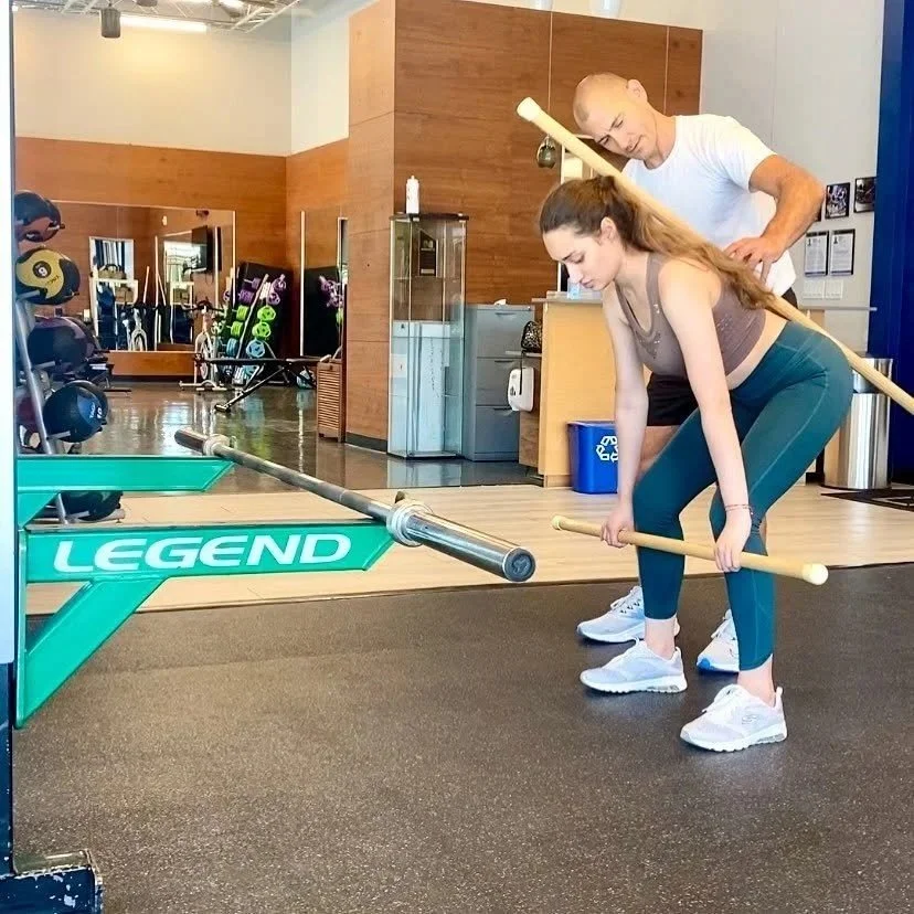 Matthew Carney providing personal training at the gym
