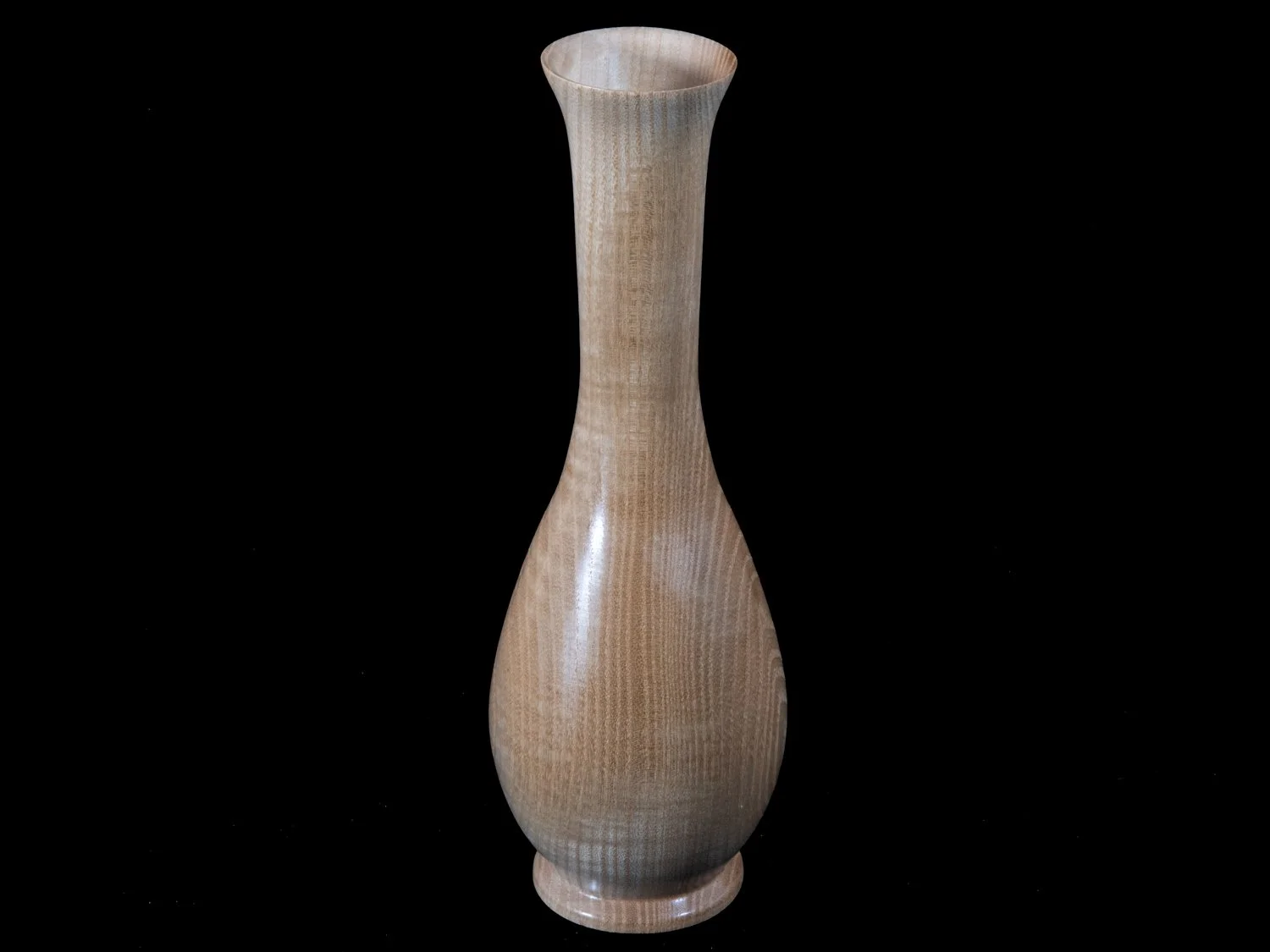 A tall, narrow wooden vase with a smooth finish and a natural wood grain pattern, placed on a black background.