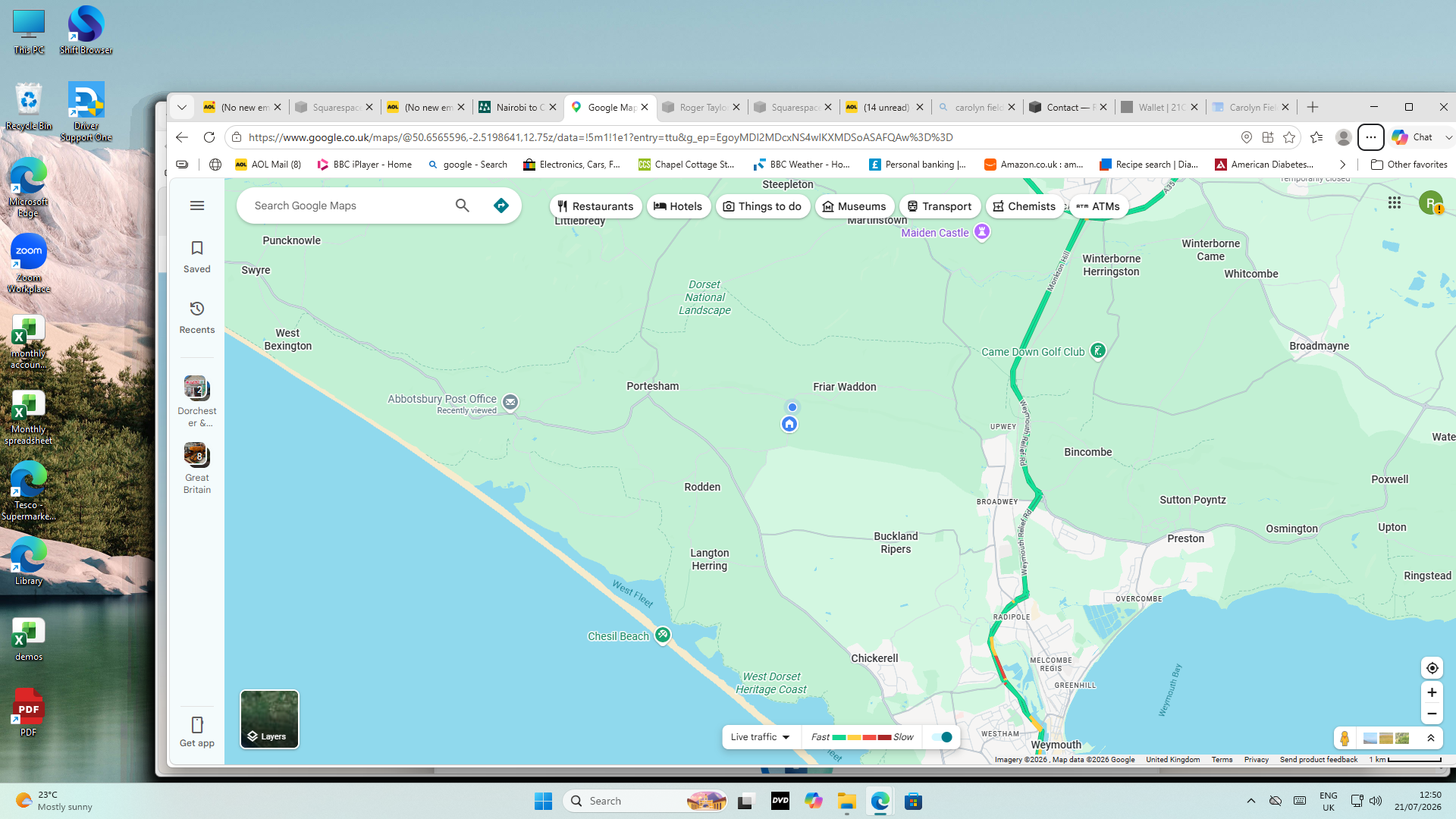 Screenshot of Google Maps showing a route along the coast of West Dorset and areas around Weymouth, with traffic conditions indicated by color. Nearby locations include Weymouth, Preston, Overcombe, and Chesil Beach.