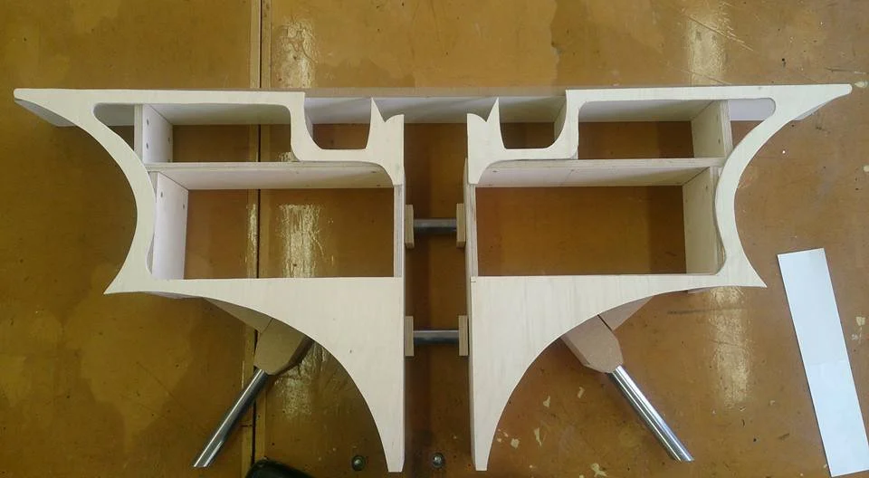 Plywood used for strength and is light weight could also be painted and finished. A wood finish and grain wasn't needed. 