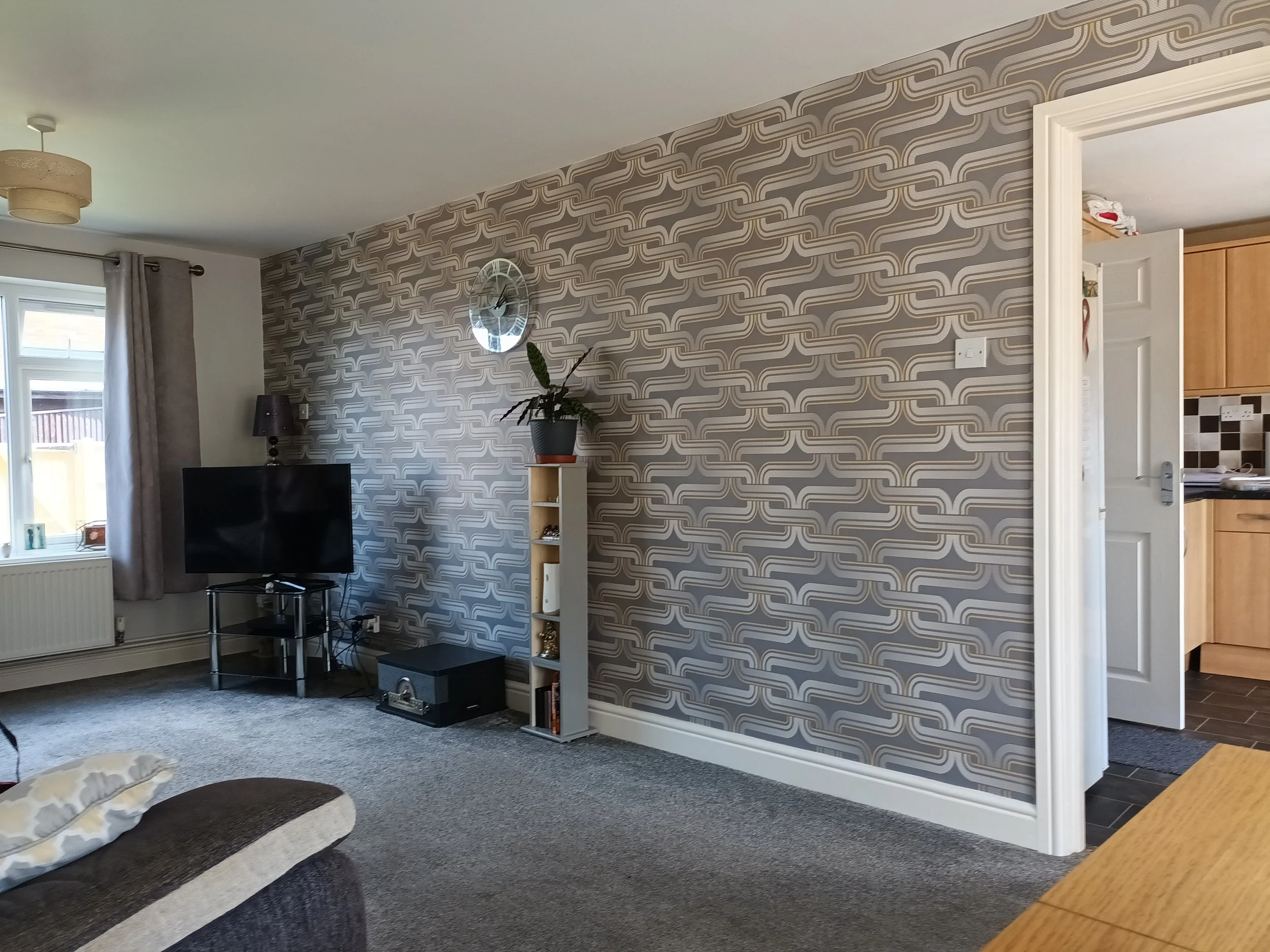 A large open wall, the unit could not fill the whole wall as would interupt the flow and ease to walk into  the room.