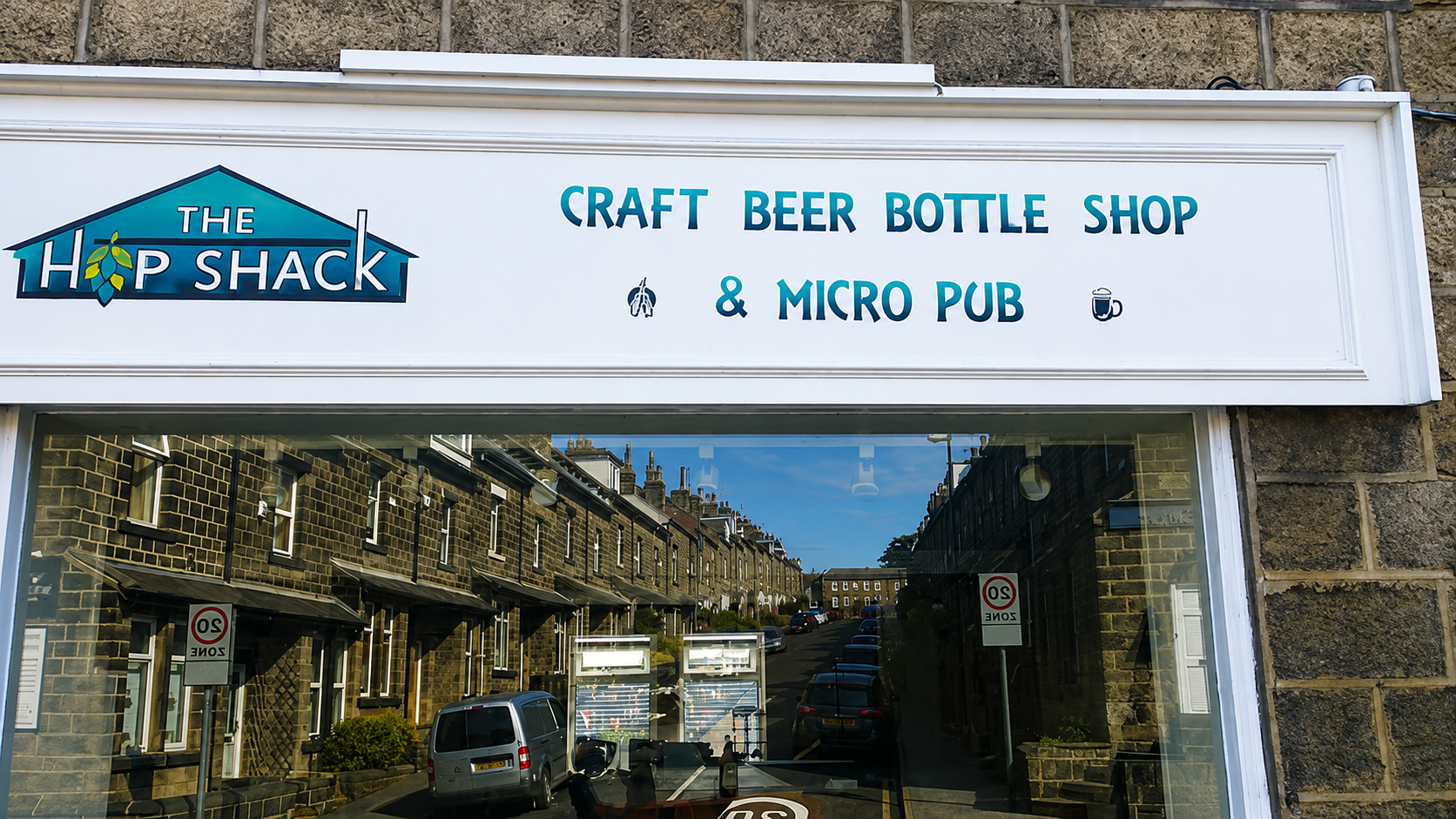 First early Painted logo on shop front.