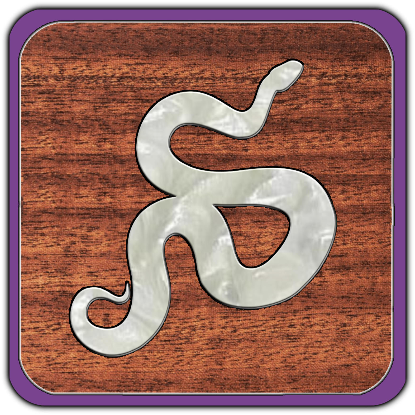 A metallic snake-shaped object on a wooden background.