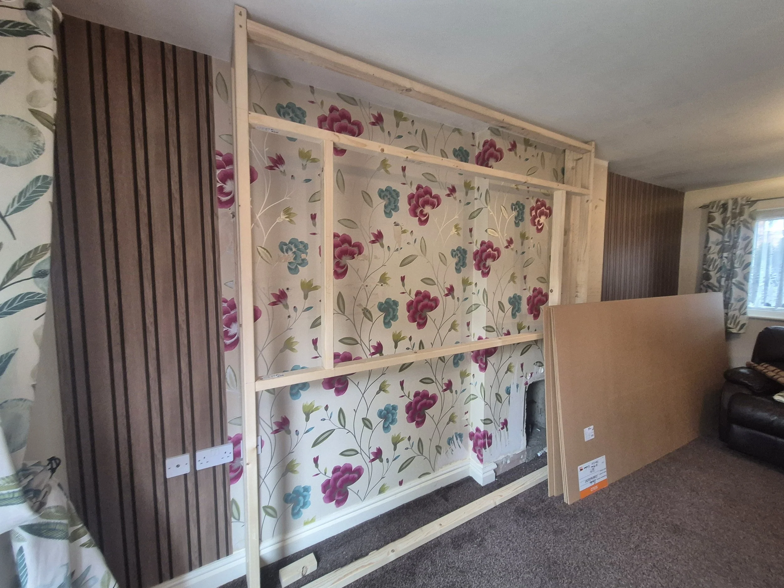New wall paper up and start of the frame work, Plug sockets on the left had to stay where they were which would affect the left shelfing later in the build. 