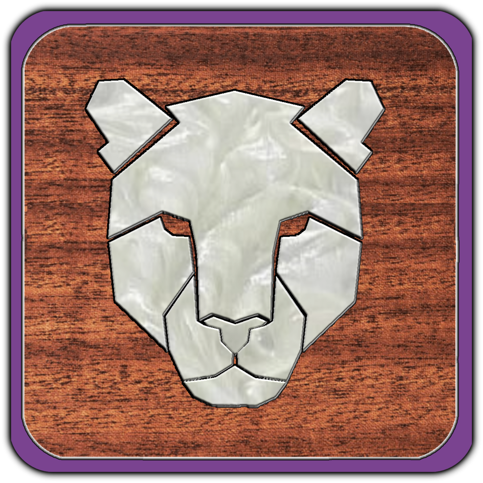 A wooden table with a vintage-style metal bear head wall decoration centered on it, framed by a purple border.