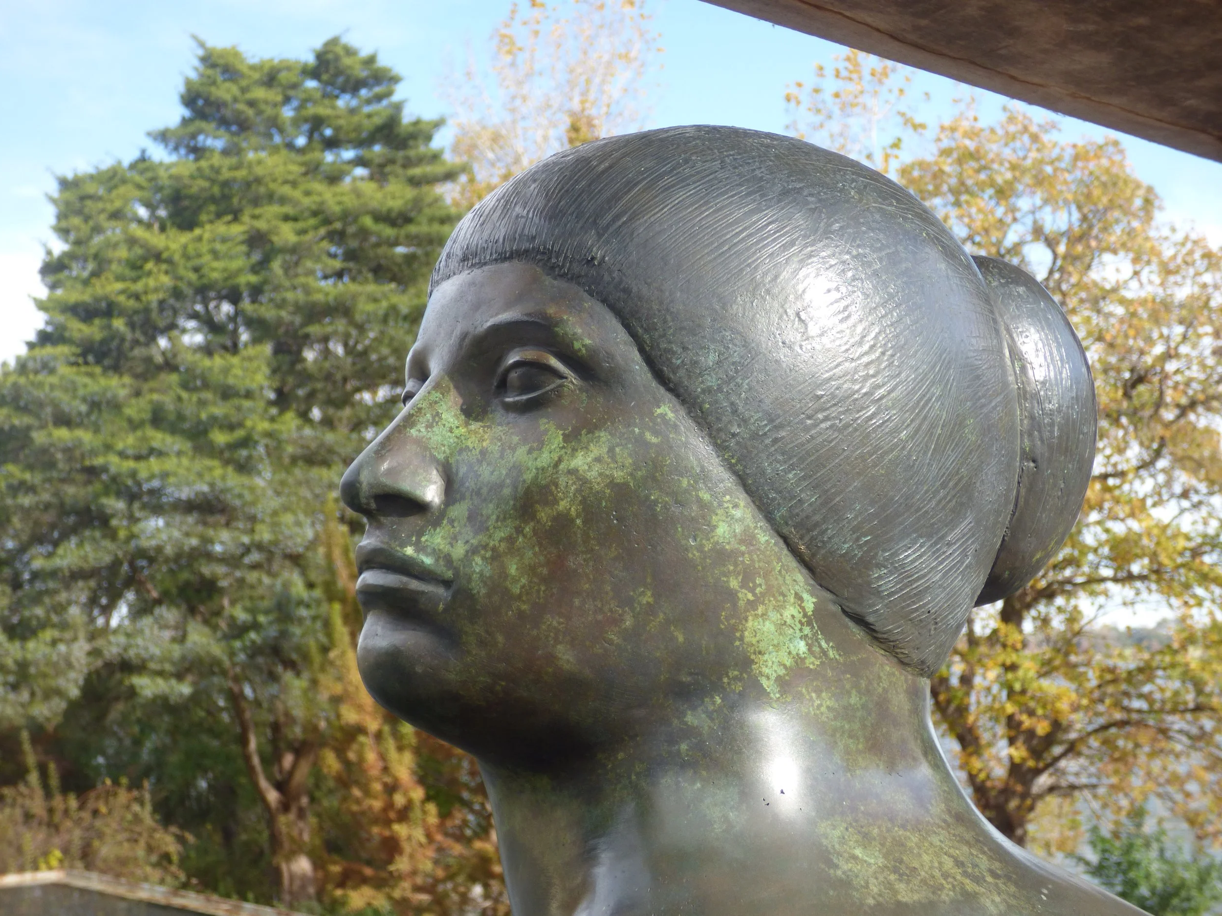 Contemplative photo by Gretchen Martens of a statue of a woman at the Dallas arboretum