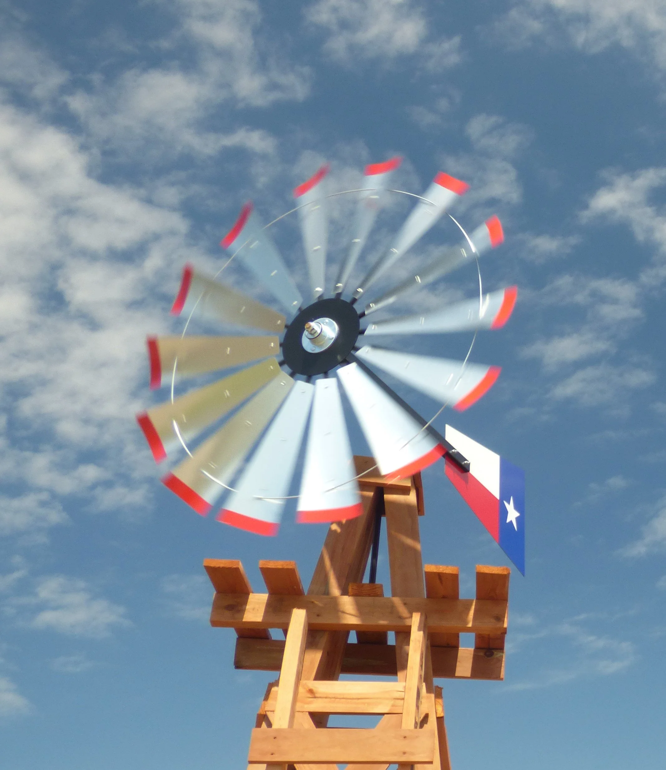 Contemplative photo by Gretchen Martens of a windmill in Texas, speaking to the Village of Care Press achievements, 350+ authors supported, 40+ books birthed