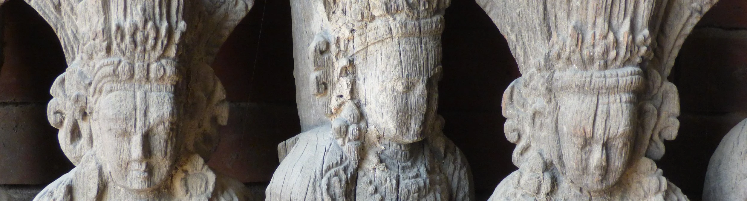 Photo by Gretchen Martens of a carving from a temple in Nepal representing gatherings—inviting women to participate in her workshops on The Glass Cradle™, The Sovereign Self, Reclamation, Storywork, Wild Becoming, Nature & Threshold Journeys™,