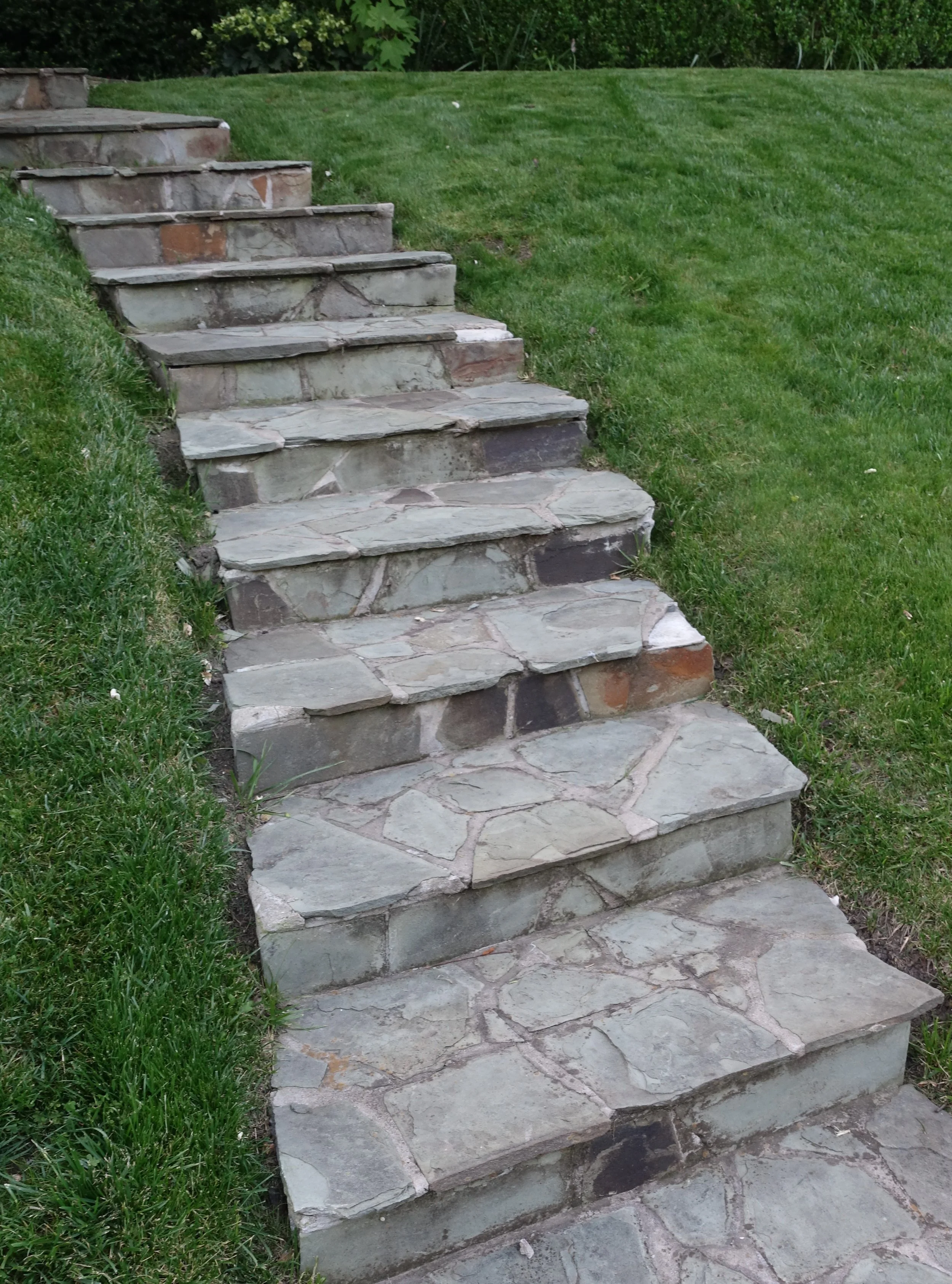 Contemplative photo by Gretchen Martens of a slate staircase rising up a hill