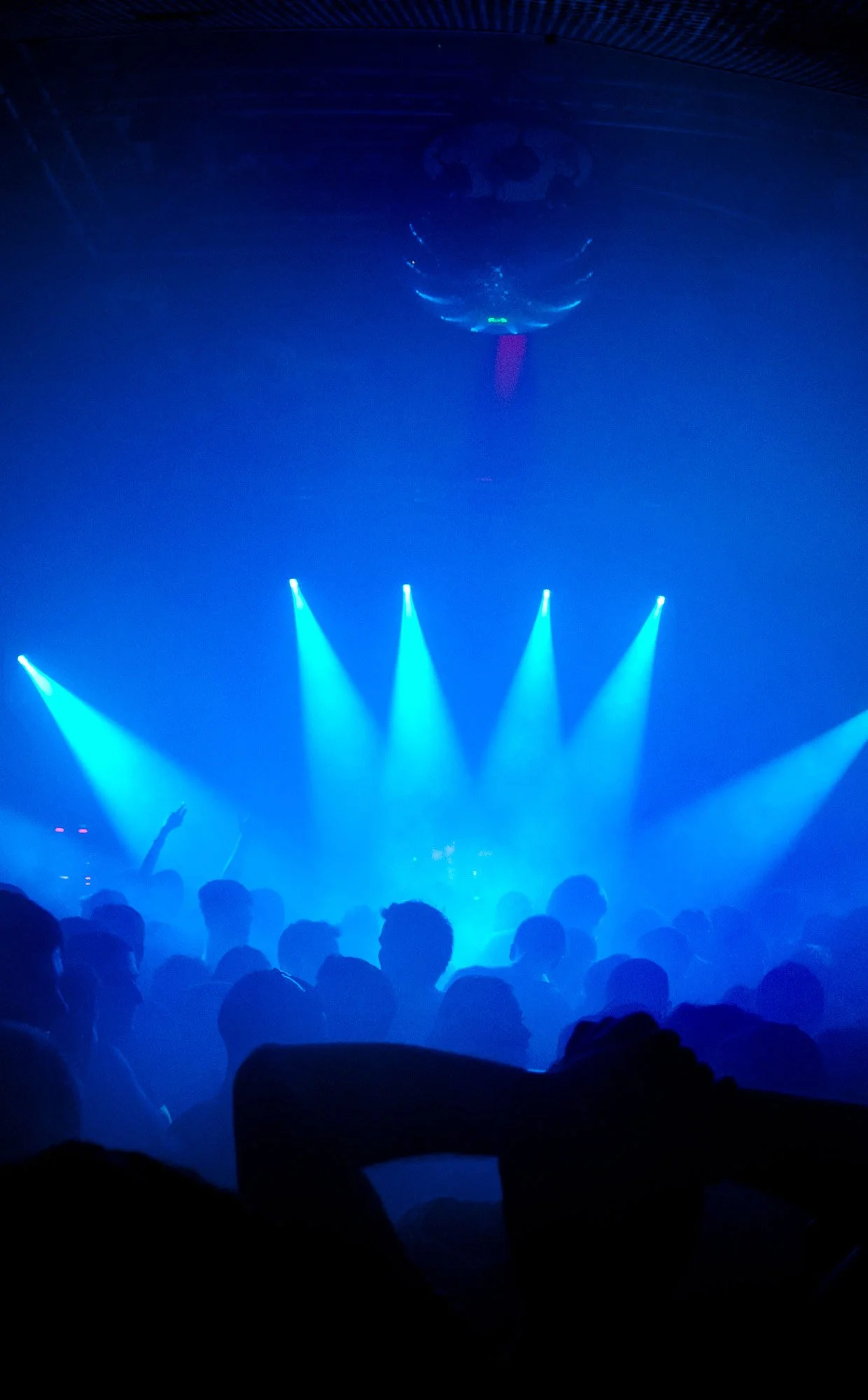 Blue stage lighting with silhouettes of crowd at Fabric nightclub, London