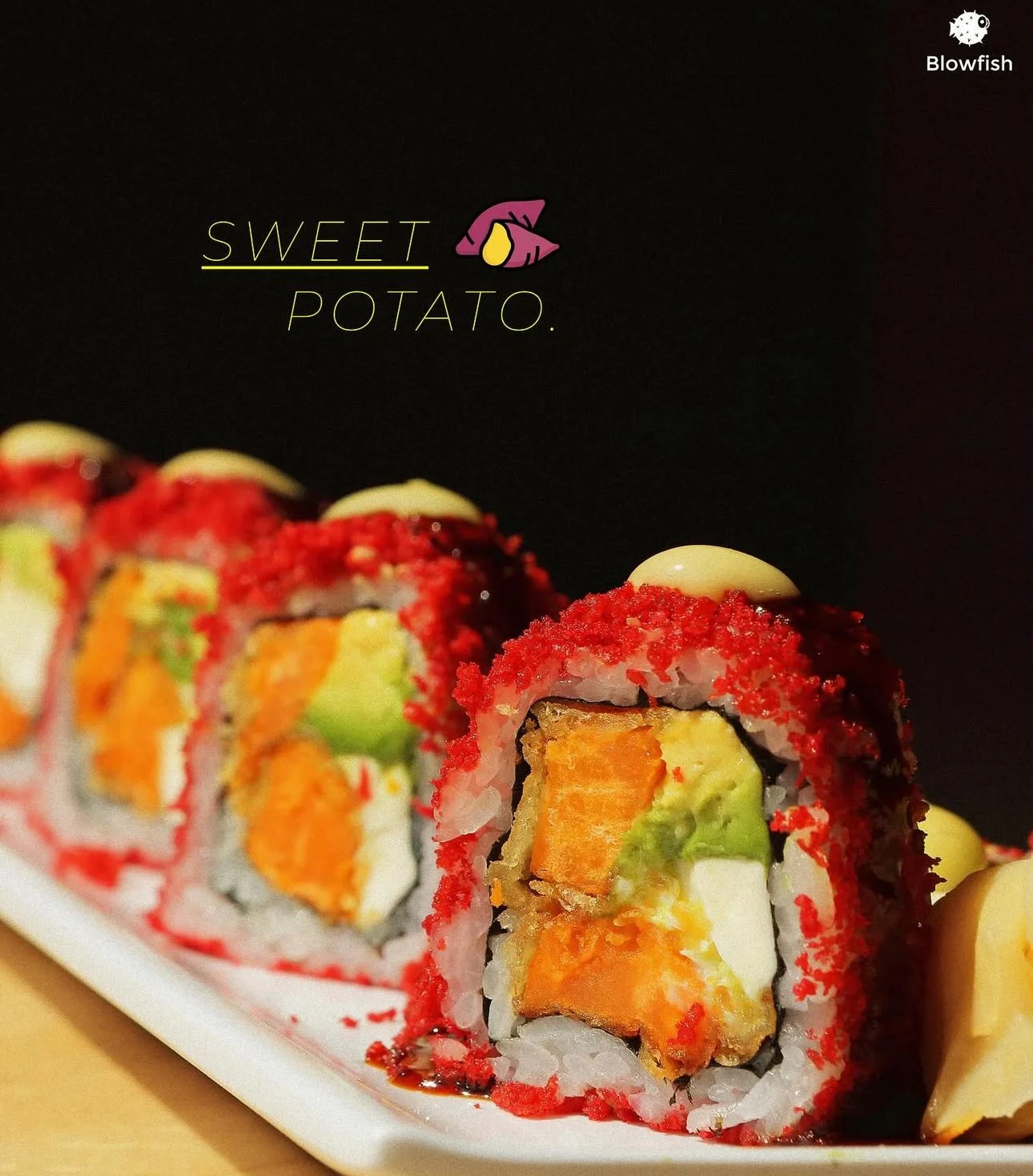 Close-up of a sushi roll with red tobiko, containing salmon, avocado, and cream cheese, topped with a dollop of mayonnaise and a colorful logo in the background.