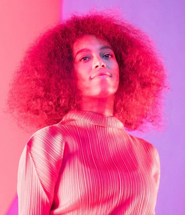 Photo of Solange Knowles with and pink and purple overlay
