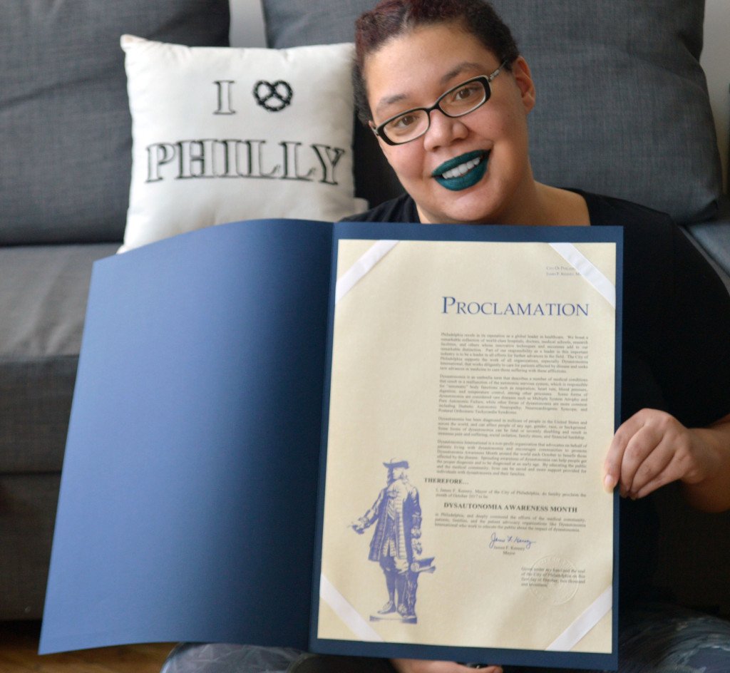 Photo of Black Woman holding proclamation
