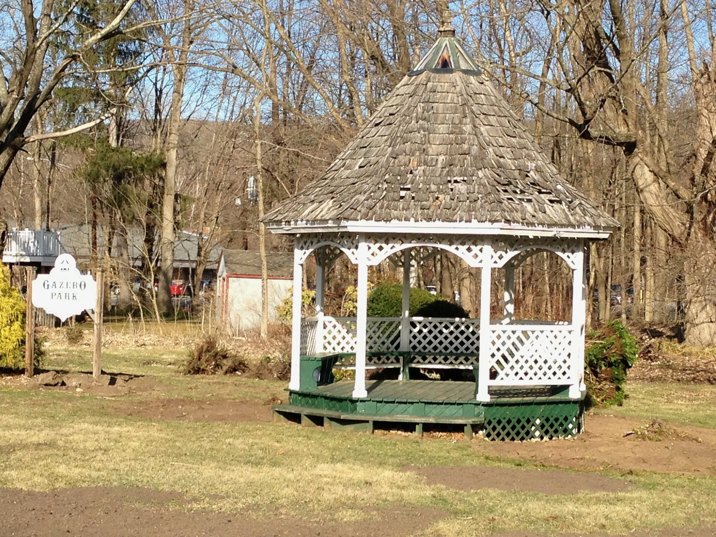 April 8, 2013 - Broken lattice work, failing roof, rotting wood, flaking paint.   Can it even be saved??