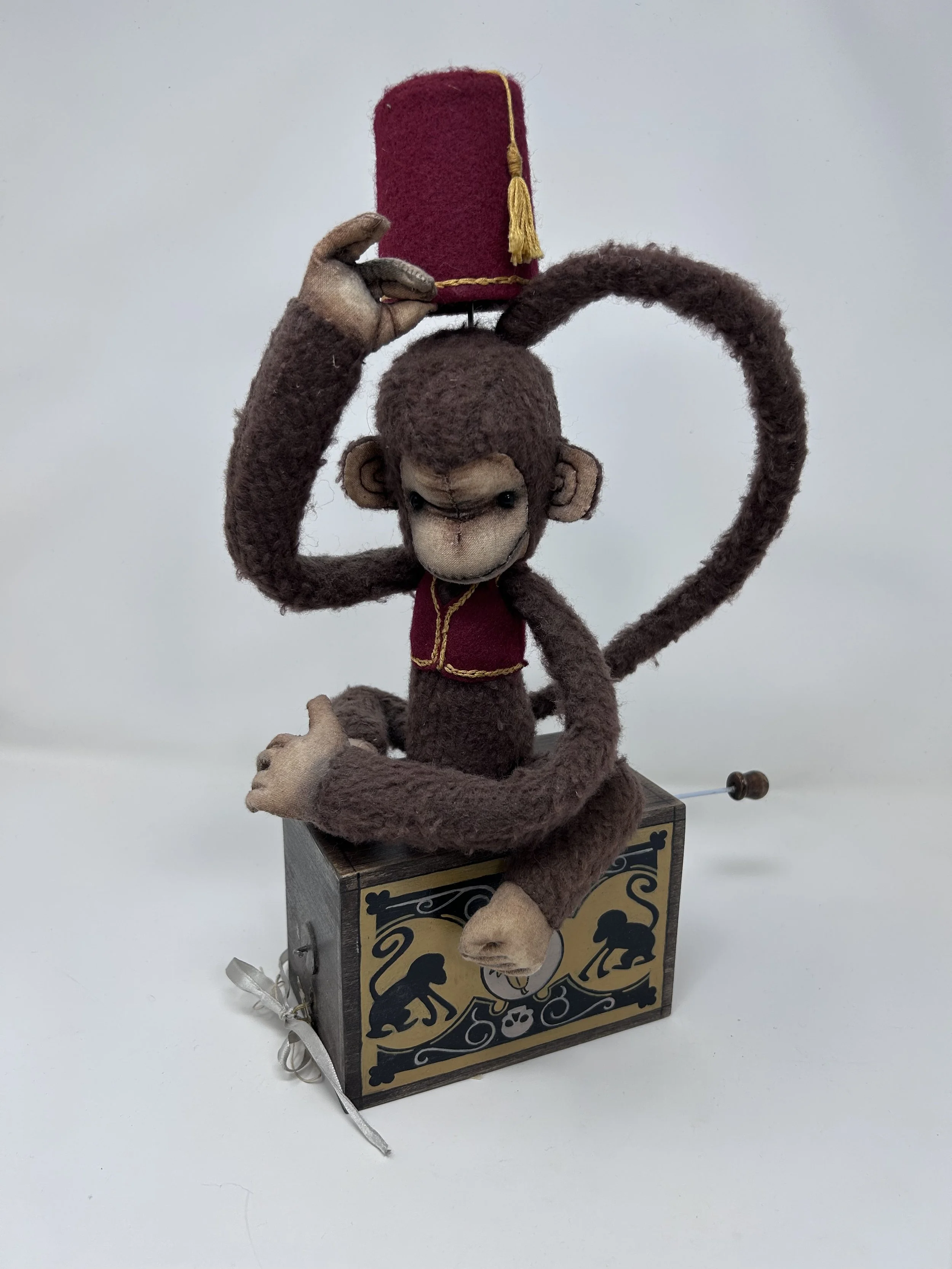 Preforming monkey 
Simple automata - when cranked, arm lifts fez up and down 
15” tall
Fabric, wire, wood 
 2018