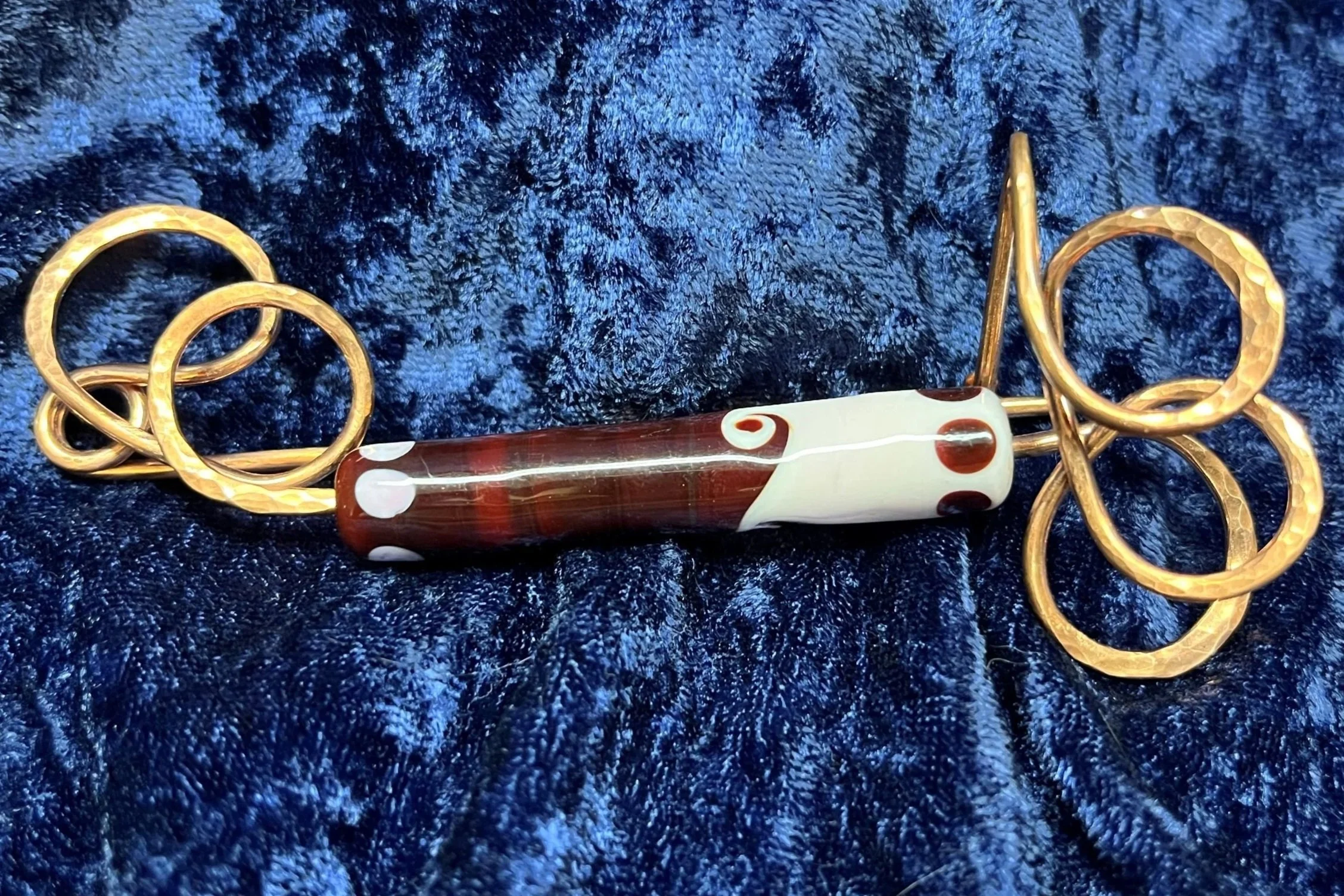 Shaw pen laying on a blue background.