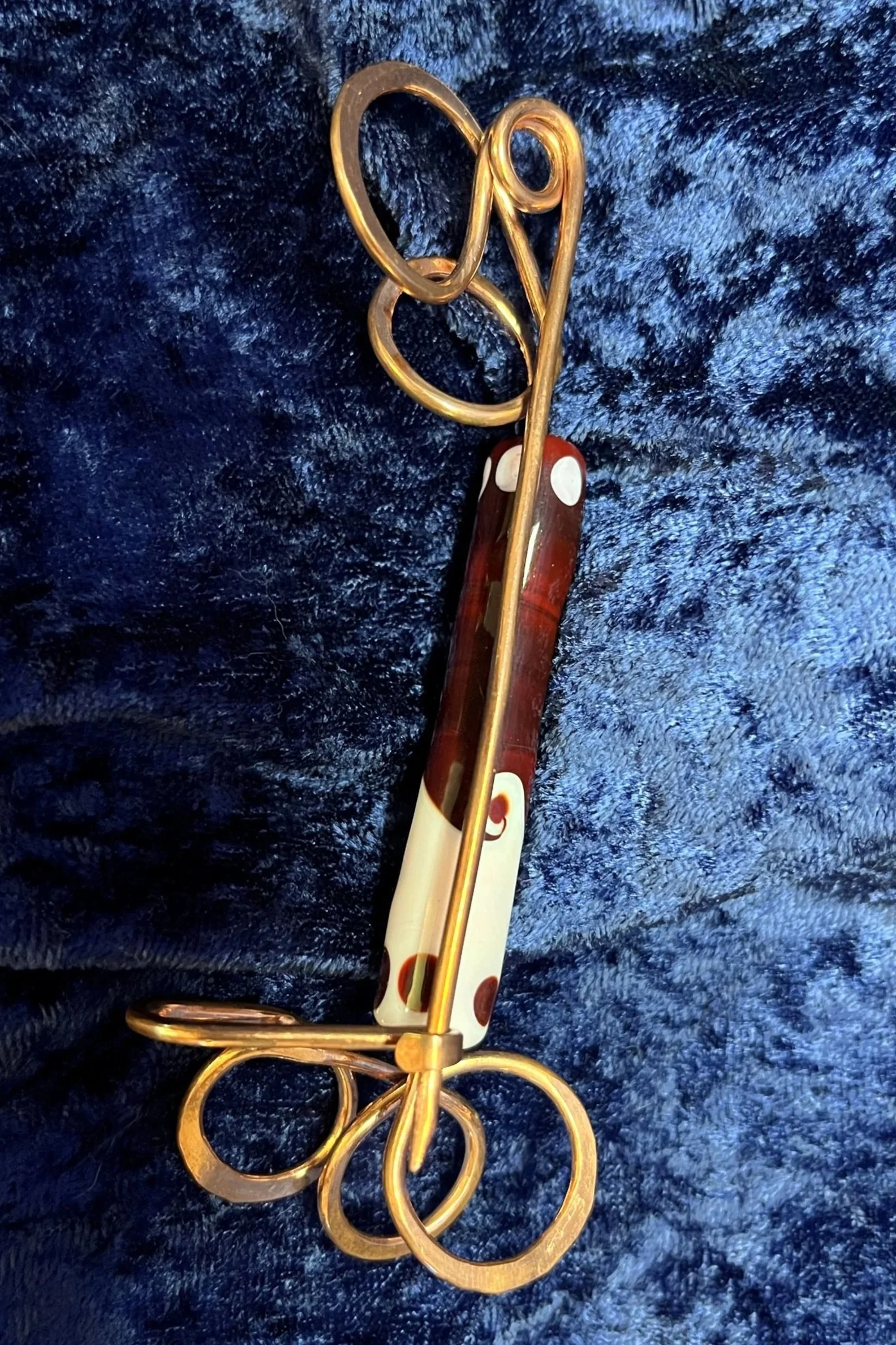 Shaw pen laying on a blue background.
