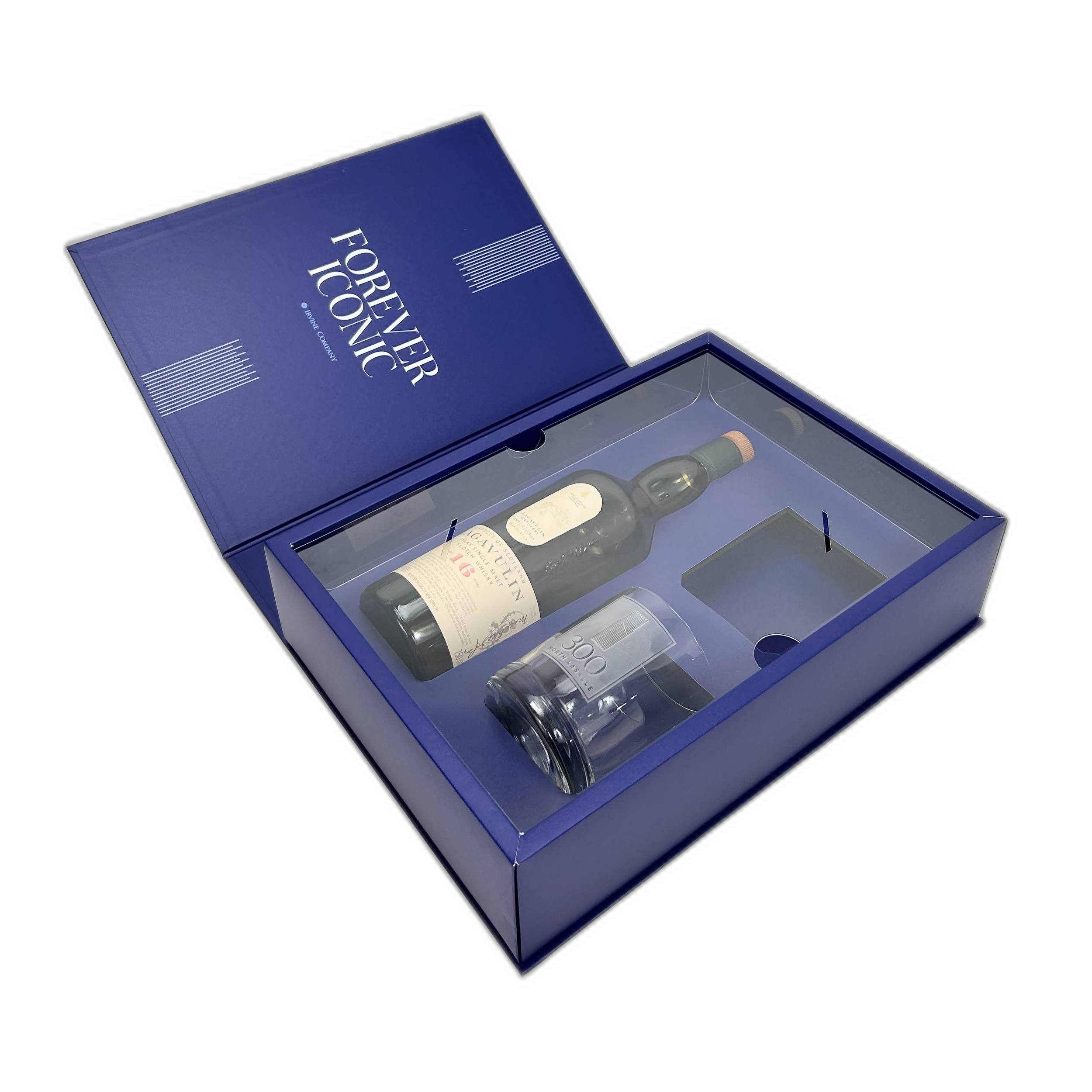 Blue box of Highland Park whisky with a partially opened lid revealing various bottles inside.