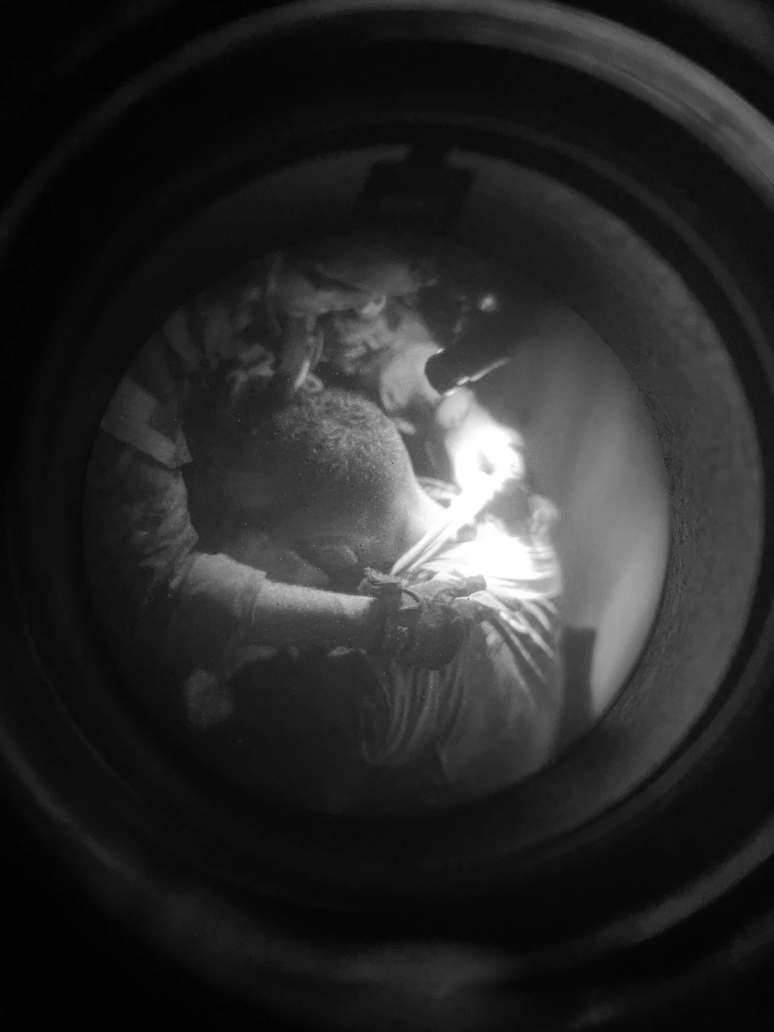 an image taken under night vision showing a special operations medic giving aid