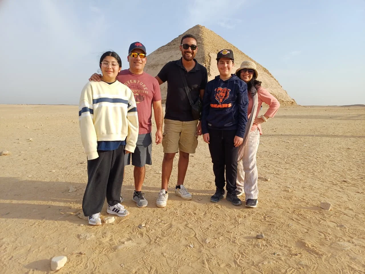 Family visiting the Pyramids of Giza on a private Egypt tour