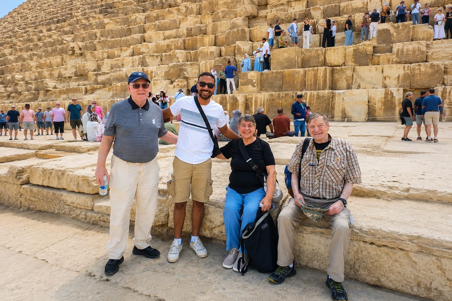 A small group of travelers at the Pyramids of Giza during an Egypt Uncharted private journey.