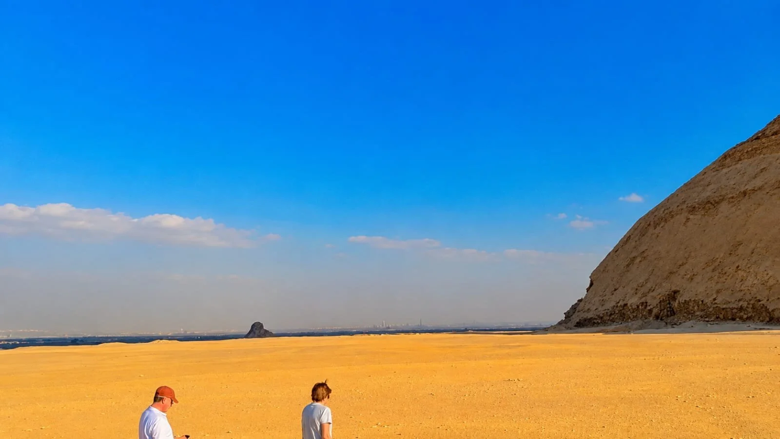 Small group walking near the Bent Pyramid, Dahshur, Egypt