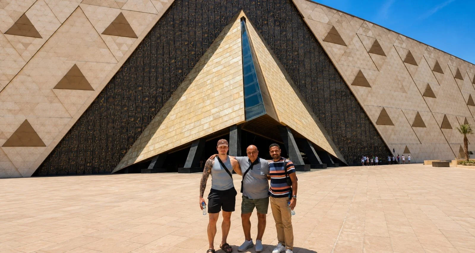 Egypt Uncharted travelers with their guide at the Pyramid of Khafre, Giza, Egypt.