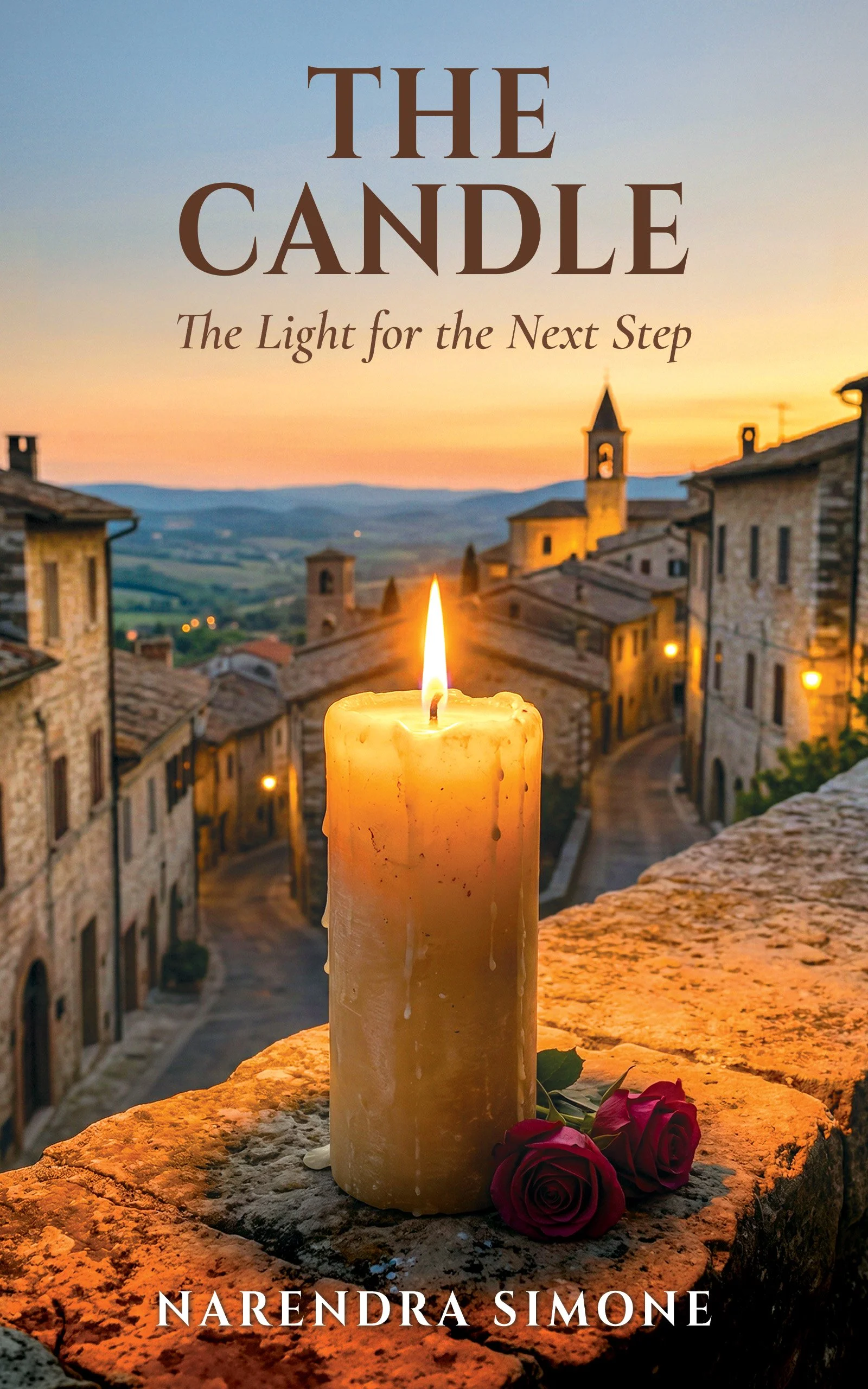 A candle burning on a stone windowsill with a historical town with stone buildings and church spires in the background during sunset, with roses at the base of the candle.