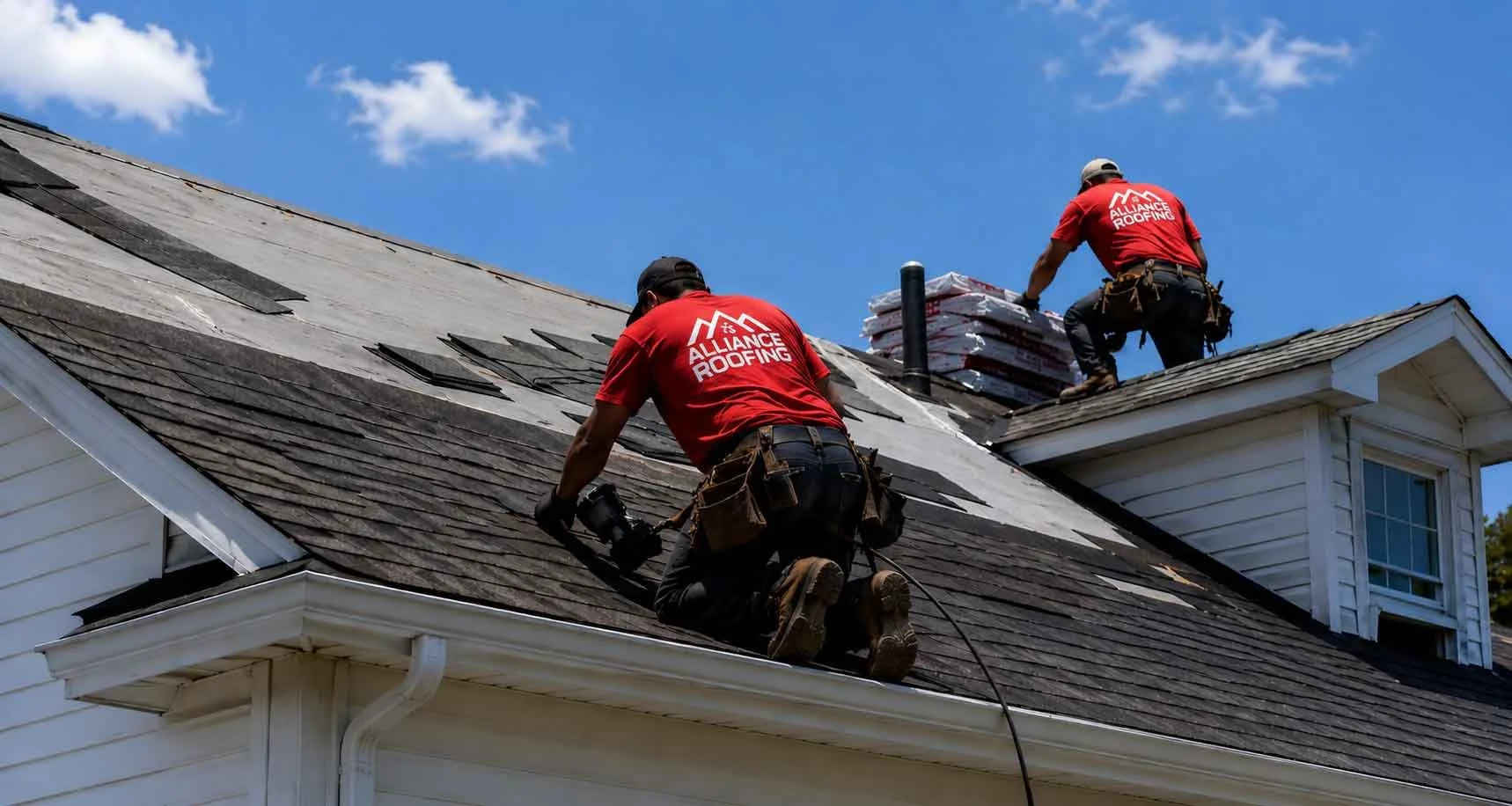 roofer working on shingle roof
