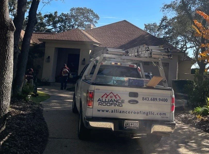 Alliance Roofing Service Truck at house for  roof inspection