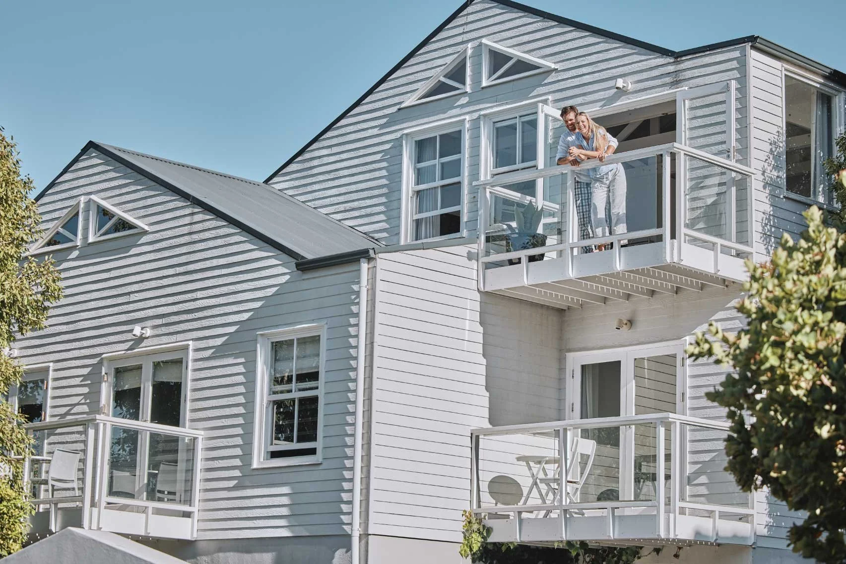 homeowners enjoying newly painted home
