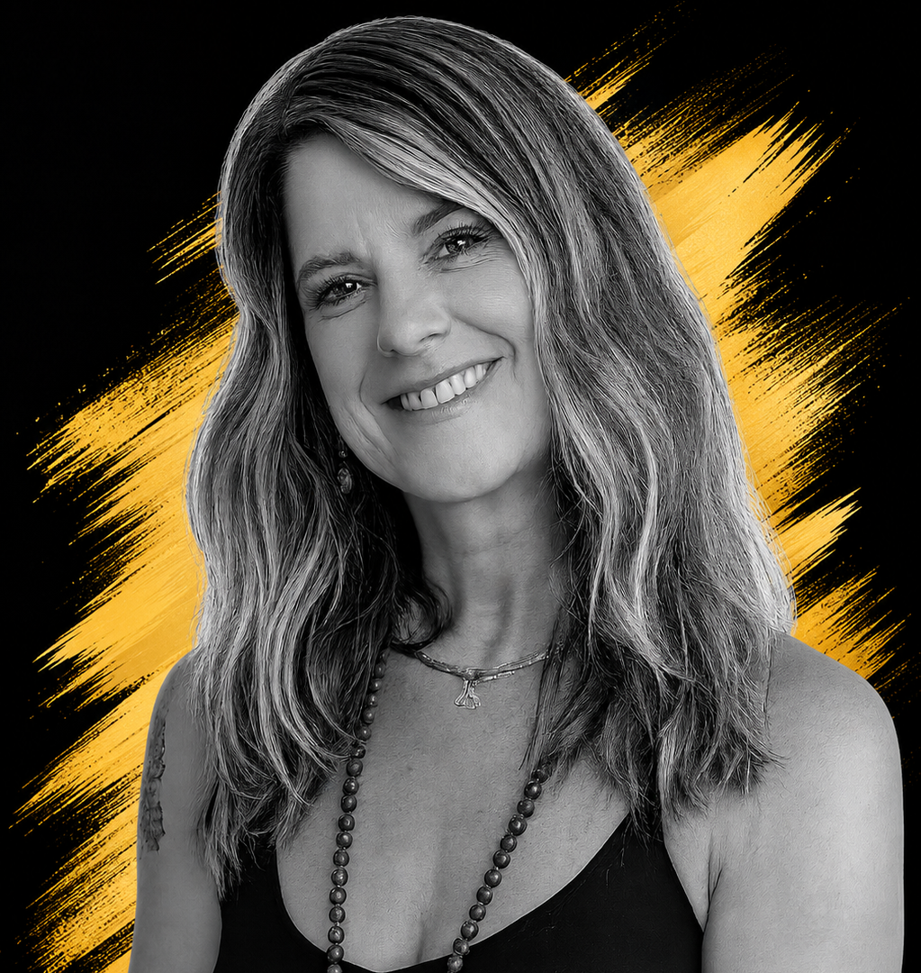 Black and white portrait of a smiling woman with wavy hair, wearing a necklace and earrings, against a black background with yellow brush stroke accents.