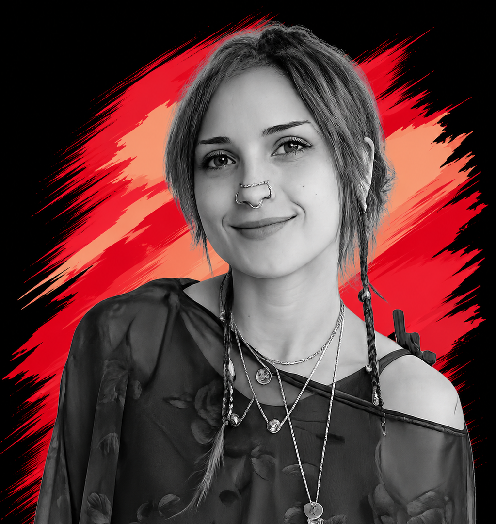 A black-and-white portrait of a young woman with short, tousled hair and a nose ring, wearing layered necklaces and a floral top, set against a colorful red and orange abstract background.