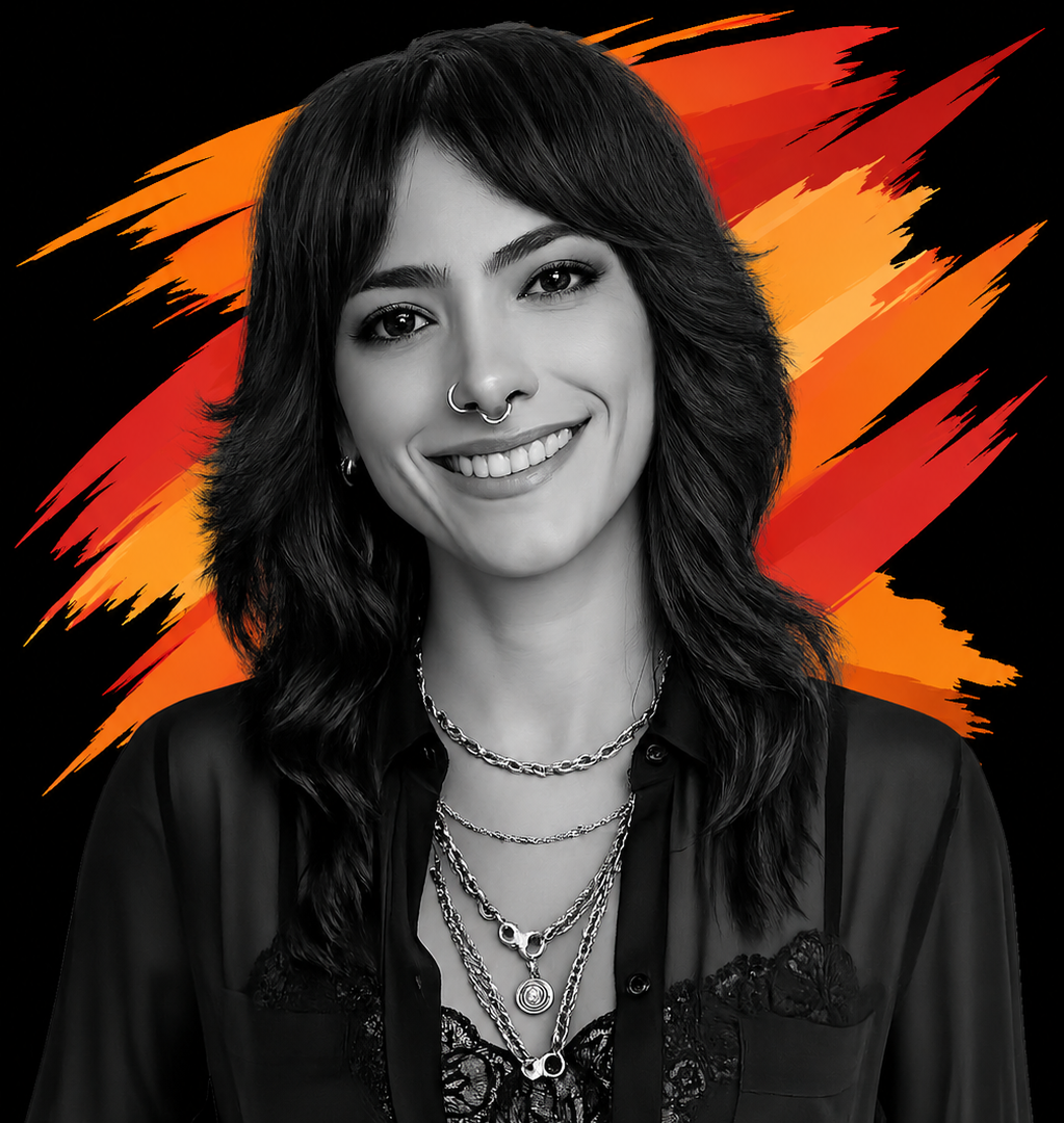 Black and white portrait of a young woman with dark wavy hair, smiling, wearing multiple silver necklaces, a nose ring, and earrings, with a vibrant orange and red abstract background.