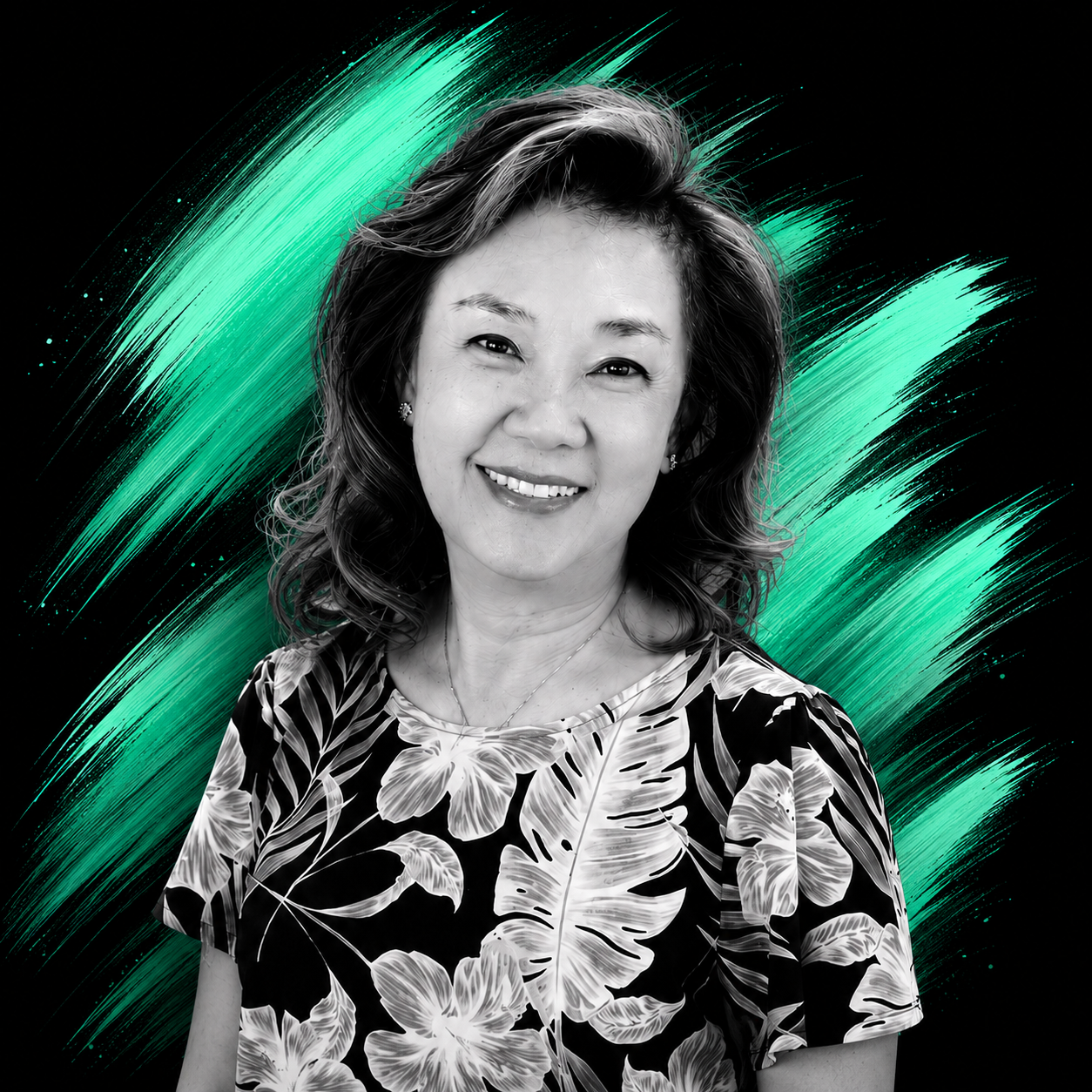 A black and white portrait of a woman smiling, with a colorful abstract background of green streaks.