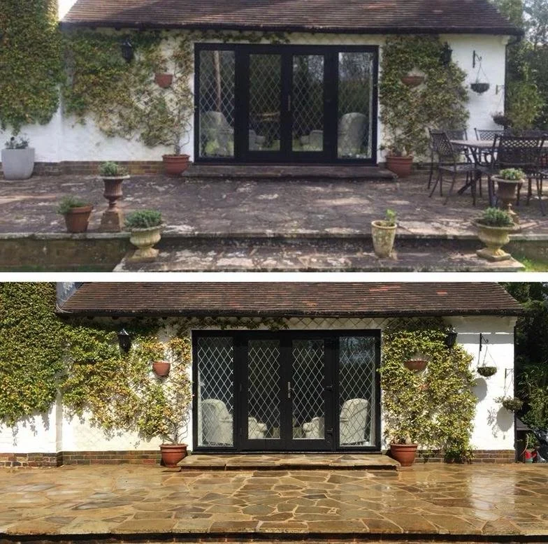 Two side-by-side images of a patio area in front of a house. The first image shows a weathered patio with a sliding glass door, potted plants, and a small table with chairs. The second image shows a renovated patio with a clean, shiny stone surface, 
