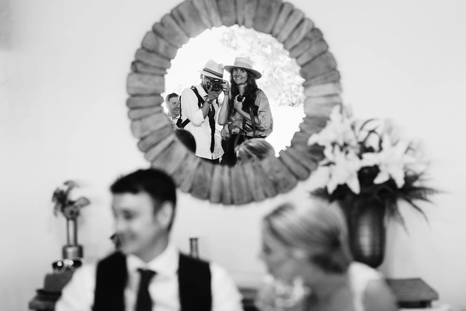 Reflection of jo Kemp and colleague behind the scenes at a destination wedding