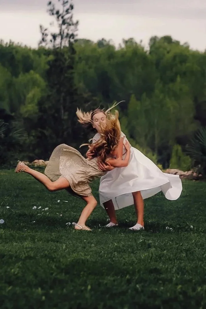 children playing on the grass at a destination wedding
