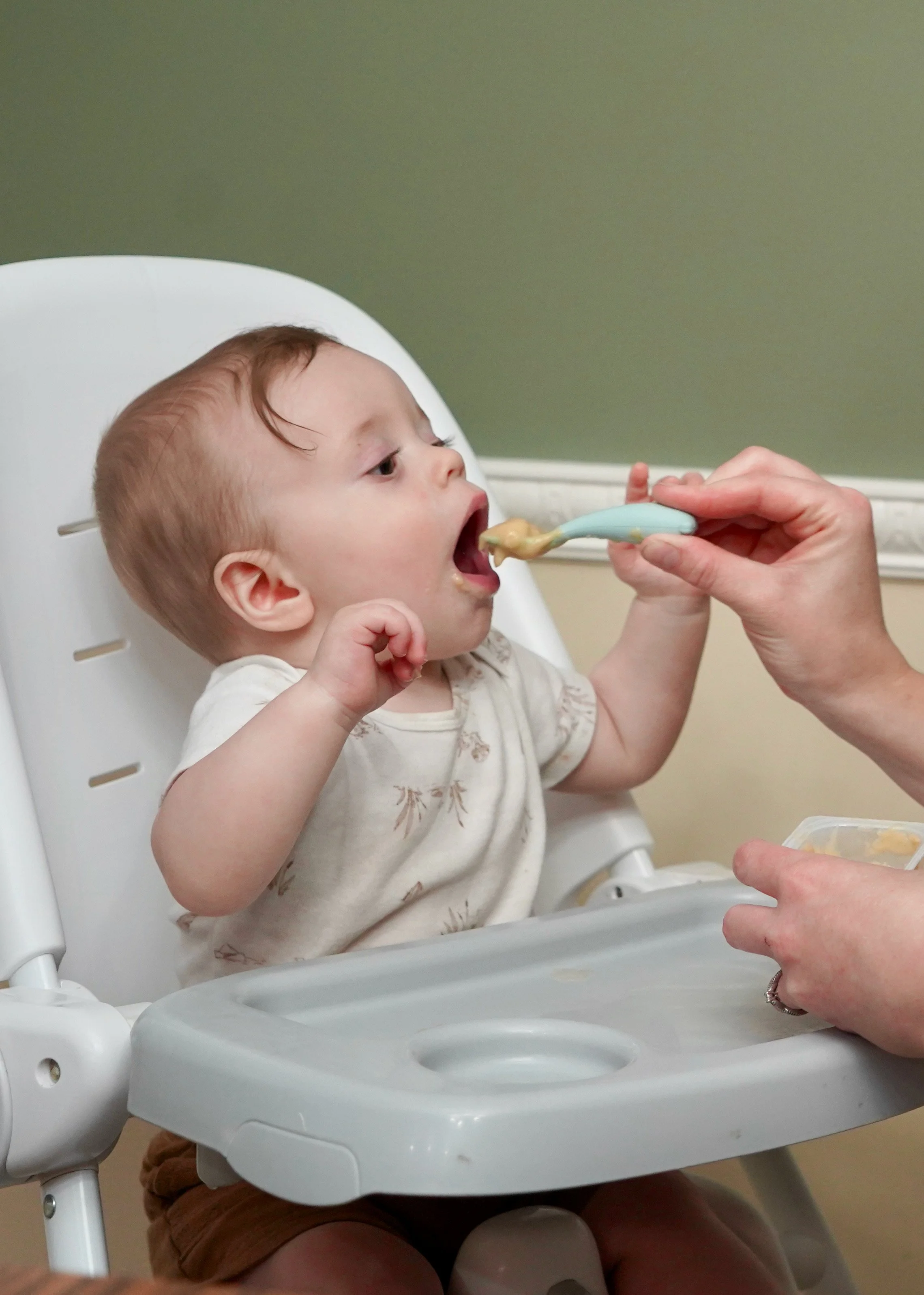 Young child working on feeding skills during an in-home pediatric occupational therapy session in Mountain Home, AR.