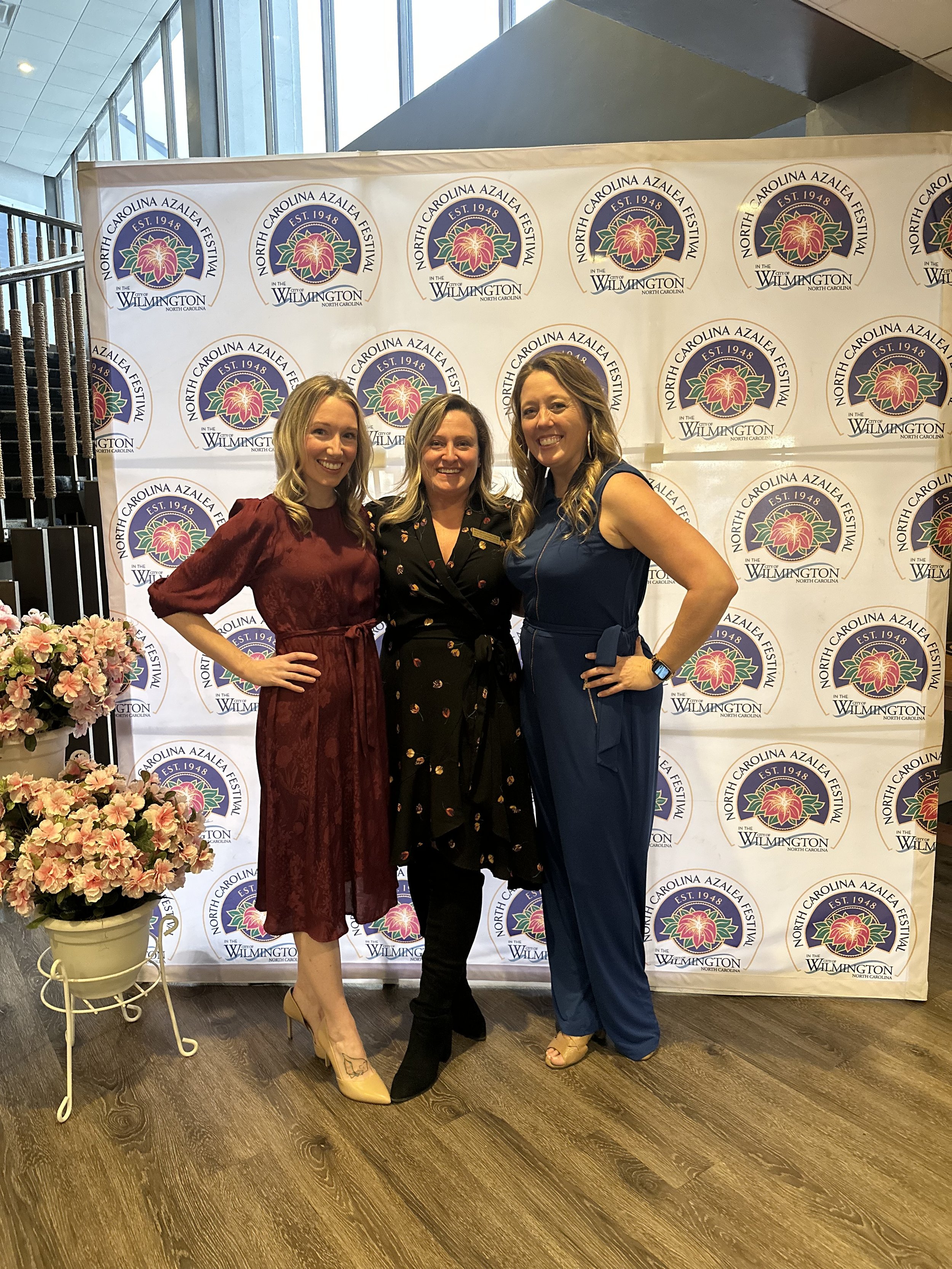 Image of Alison and two other women at a North Carolina Azalea Festival event