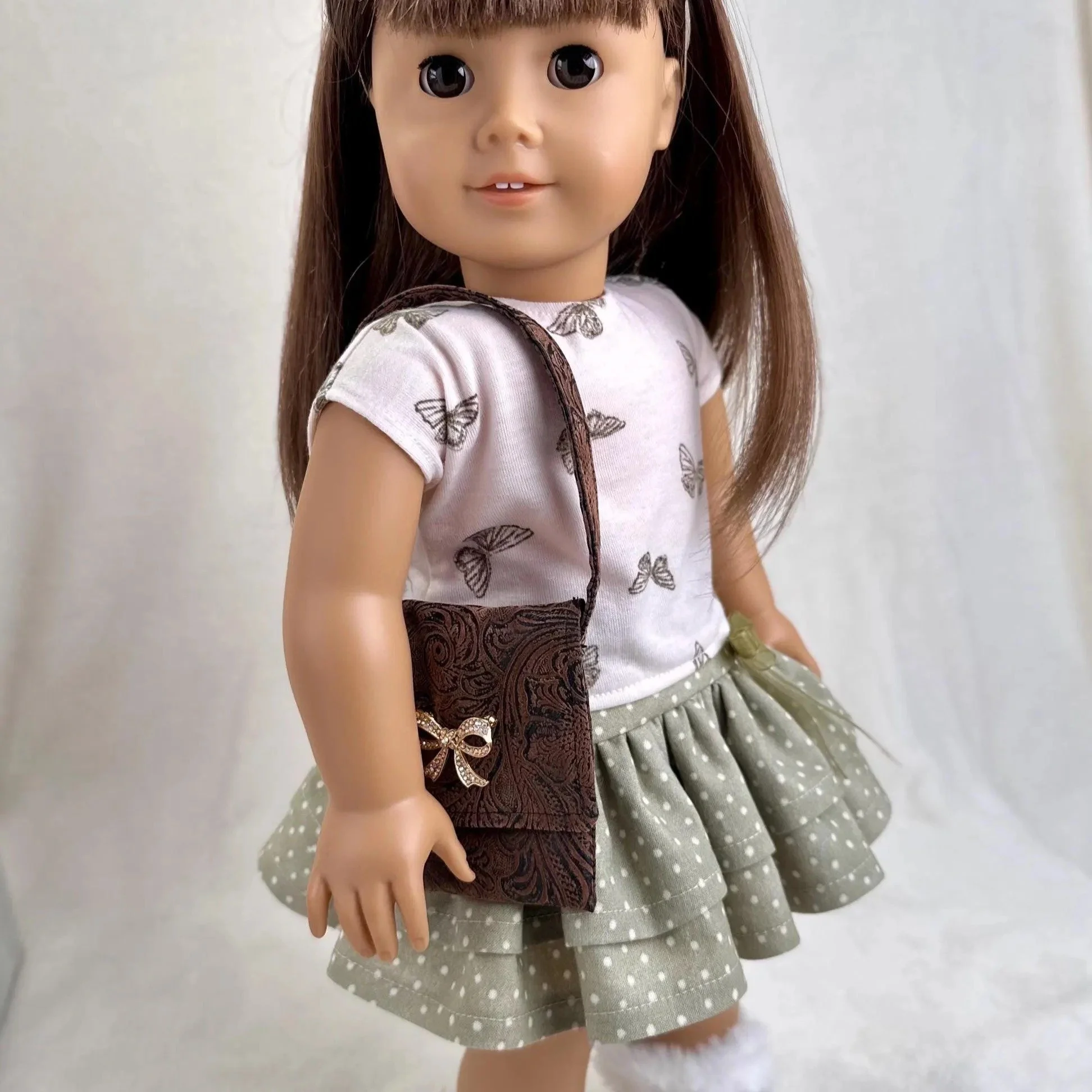 18 inch doll outfit with a skirt, t-shirt, and matching hairbow. Accessories available separately.