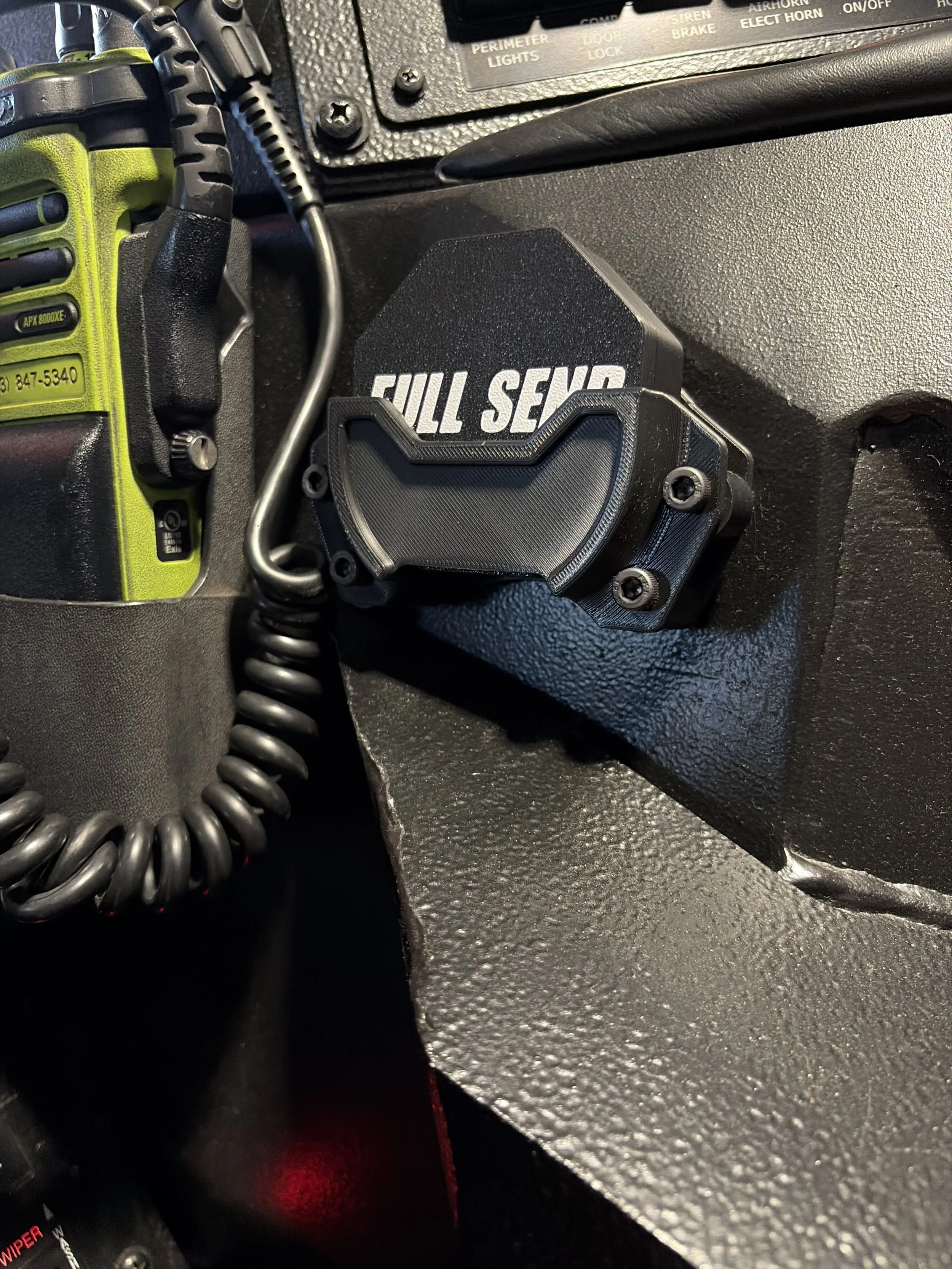 Close-up of a black vehicle dashboard with a