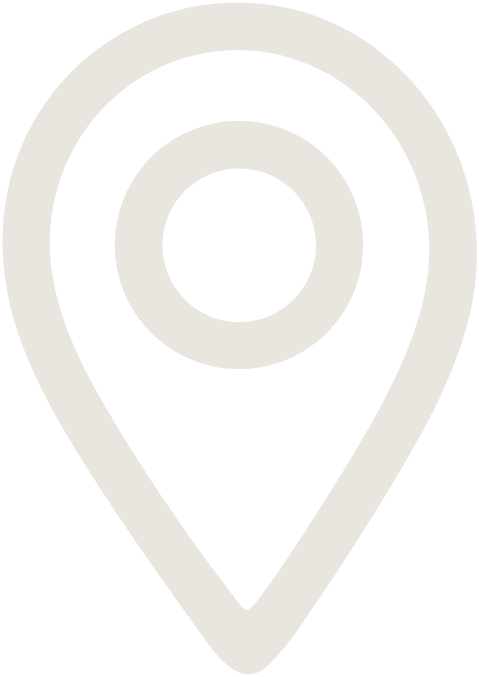 A black and white map pin icon representing a location marker.