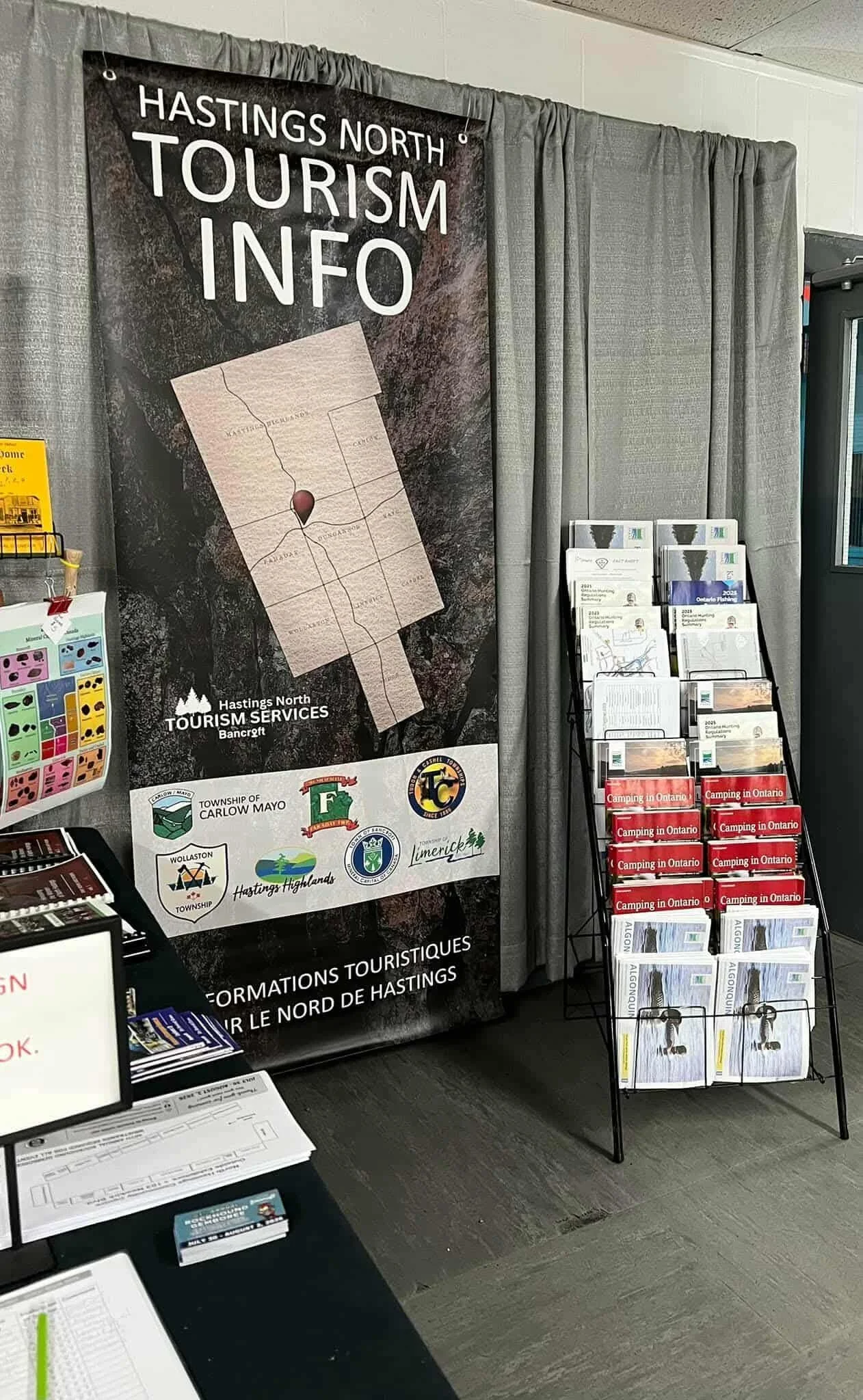 Tourism information booth for Hastings North with brochures and pamphlets about outdoor activities and camping in Ontario, Canada.