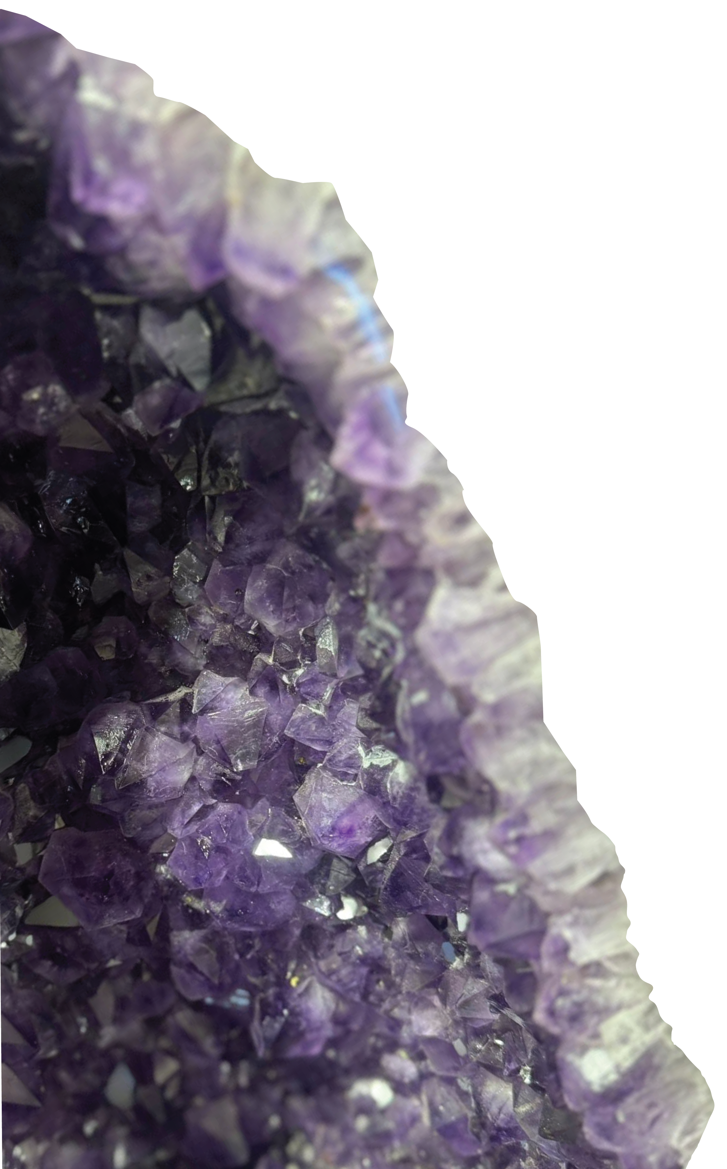 Close-up of purple and clear amethyst crystals forming a pointed cluster.