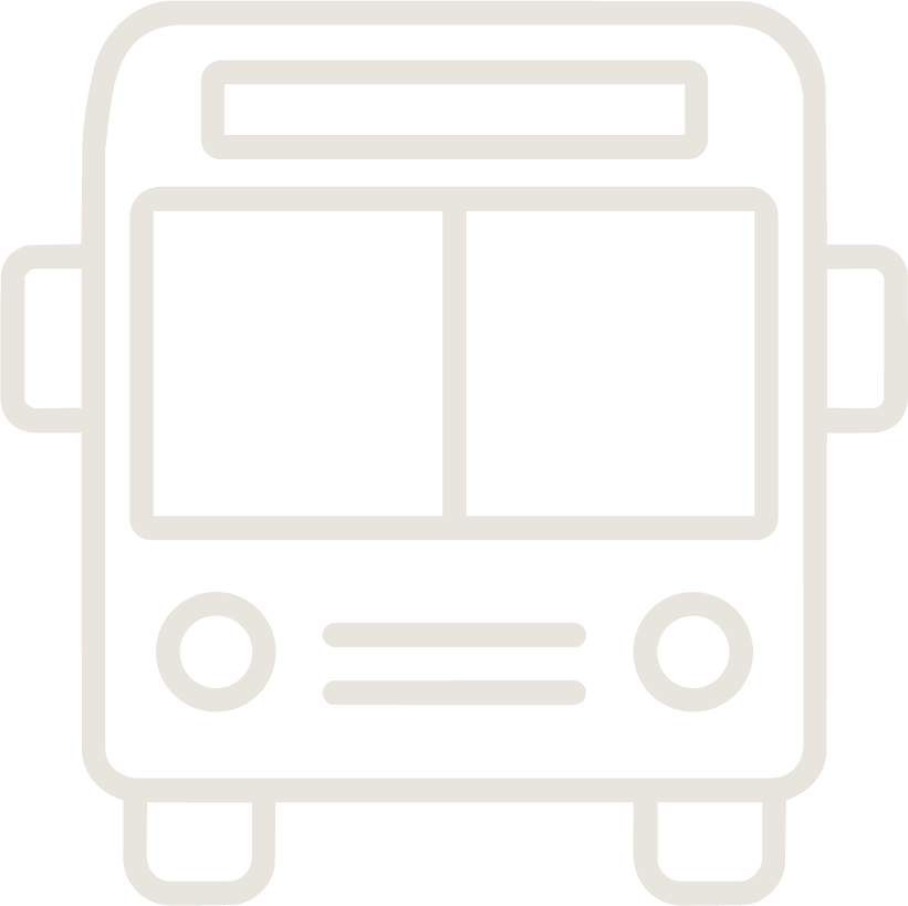 Icon of a bus viewed from the front with two headlights and a large windshield.