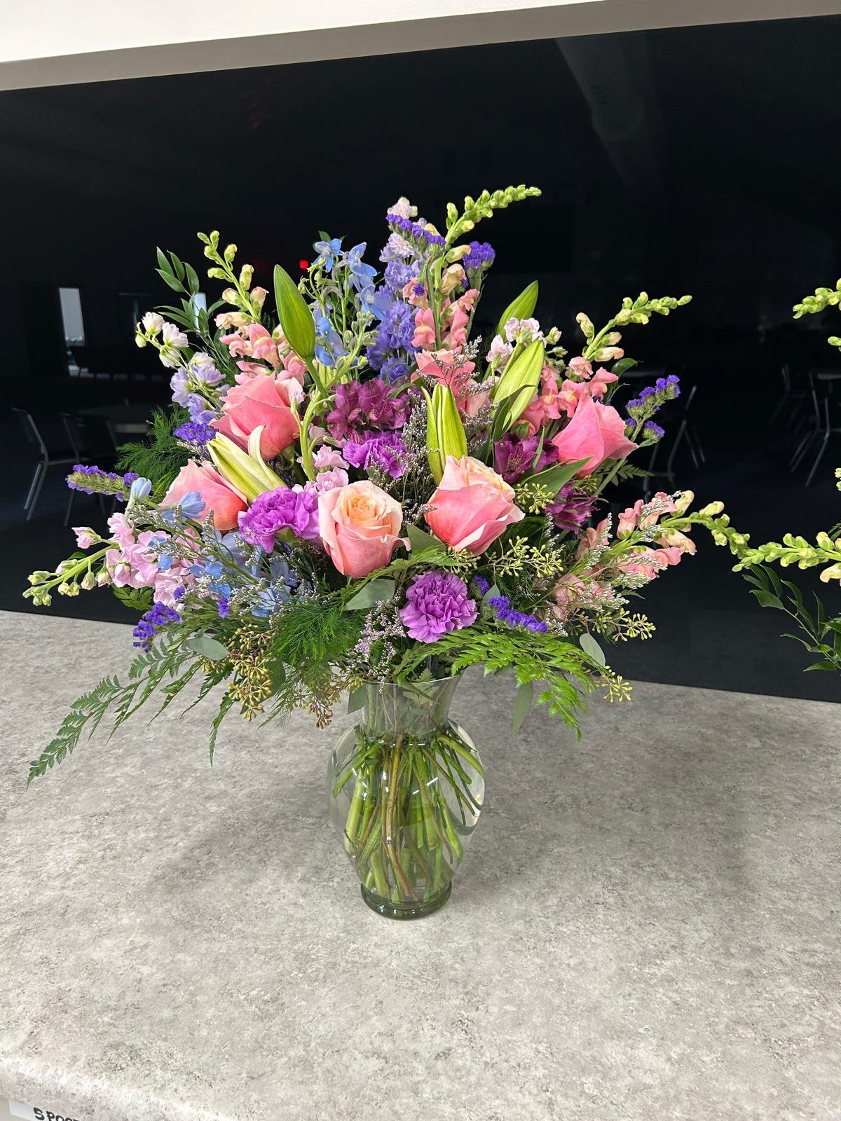 Lg Vase Arrangement ft purple statice, pink roses, and pink snapdragons.