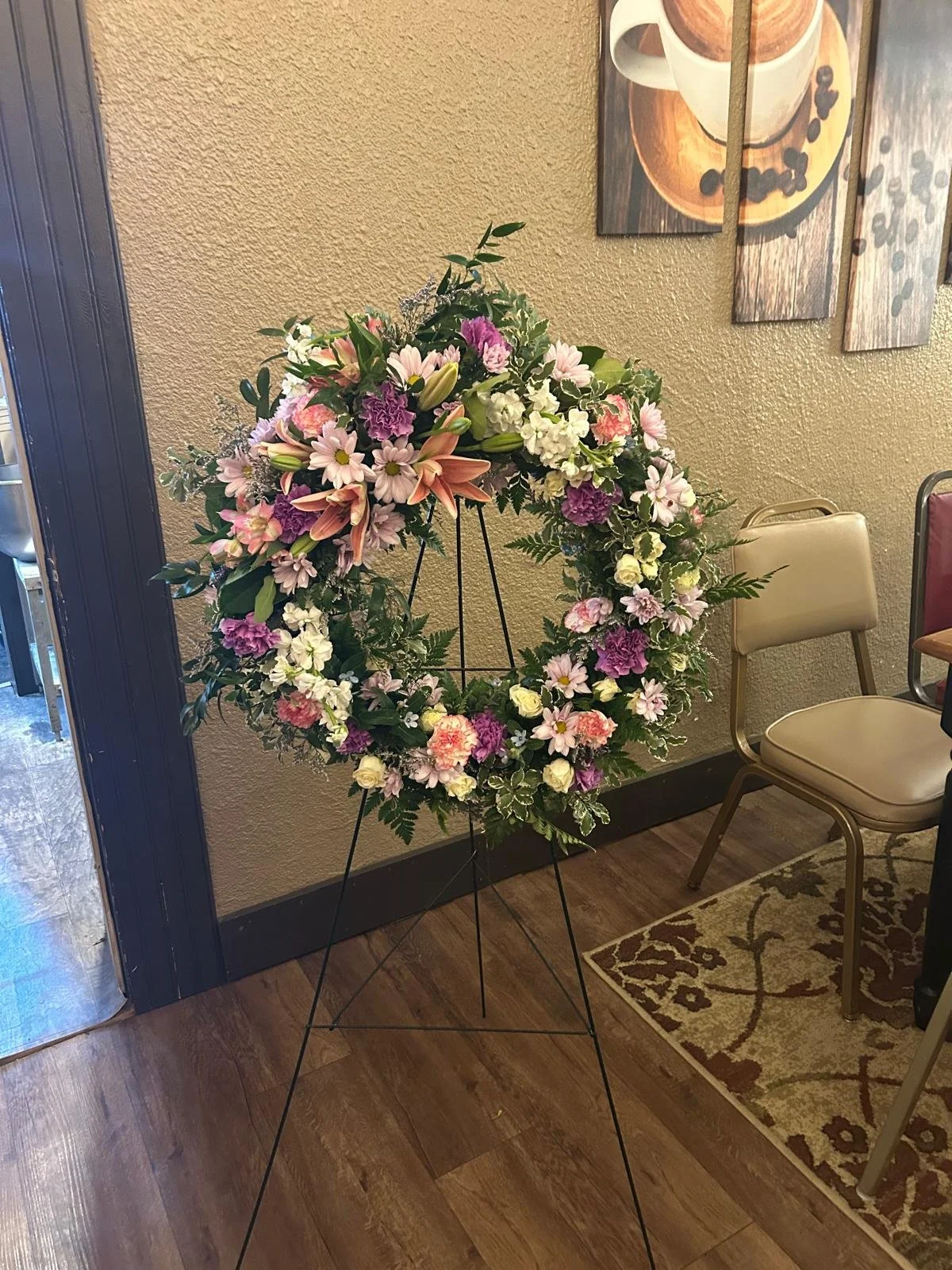 Lg Hanging Wreath, ft pink lilies, and light purple accents.