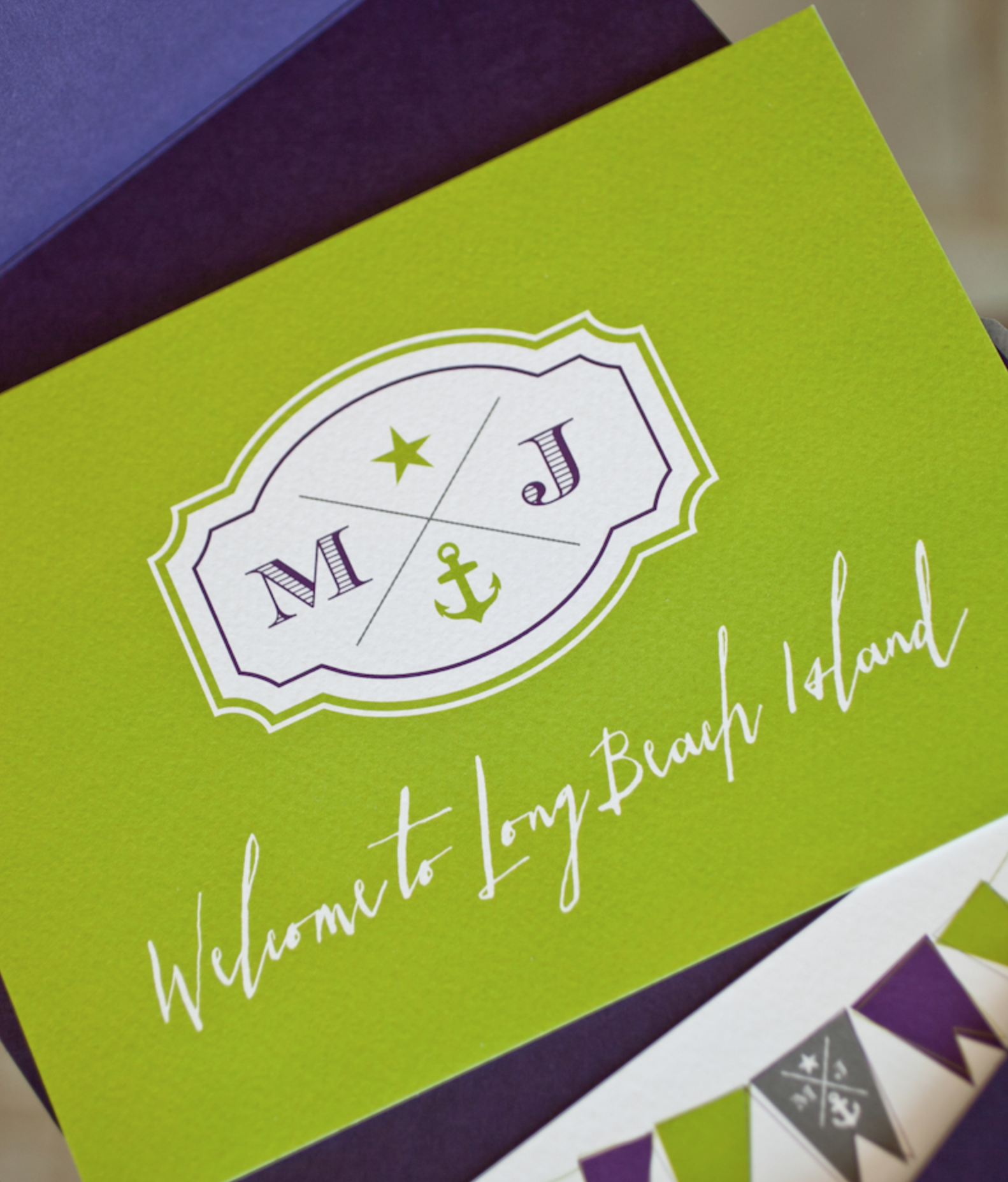 Green sign with nautical-themed emblem and the text "Welcome to Long Beach Island".